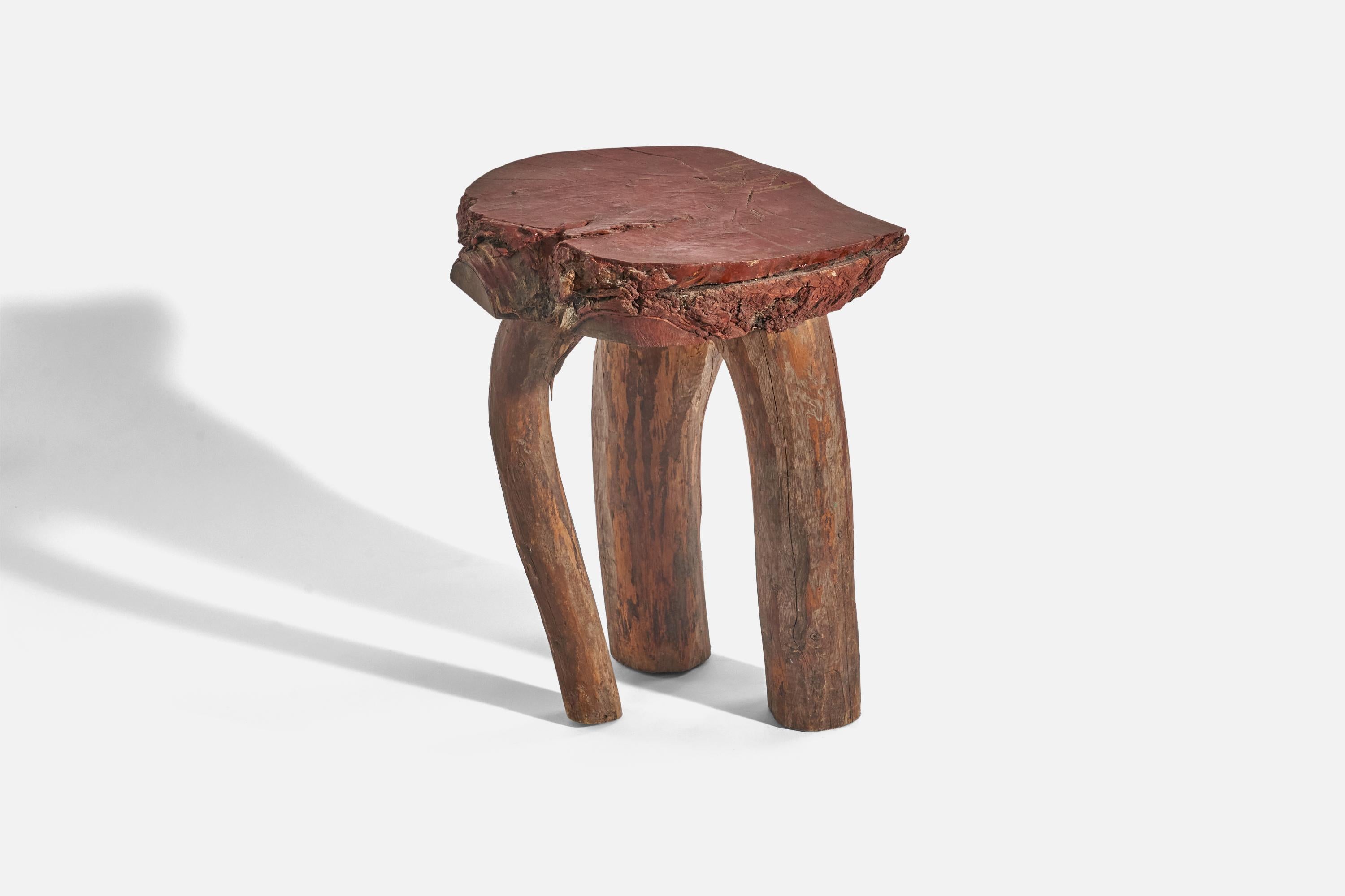 A wooden side table or stool painted in 