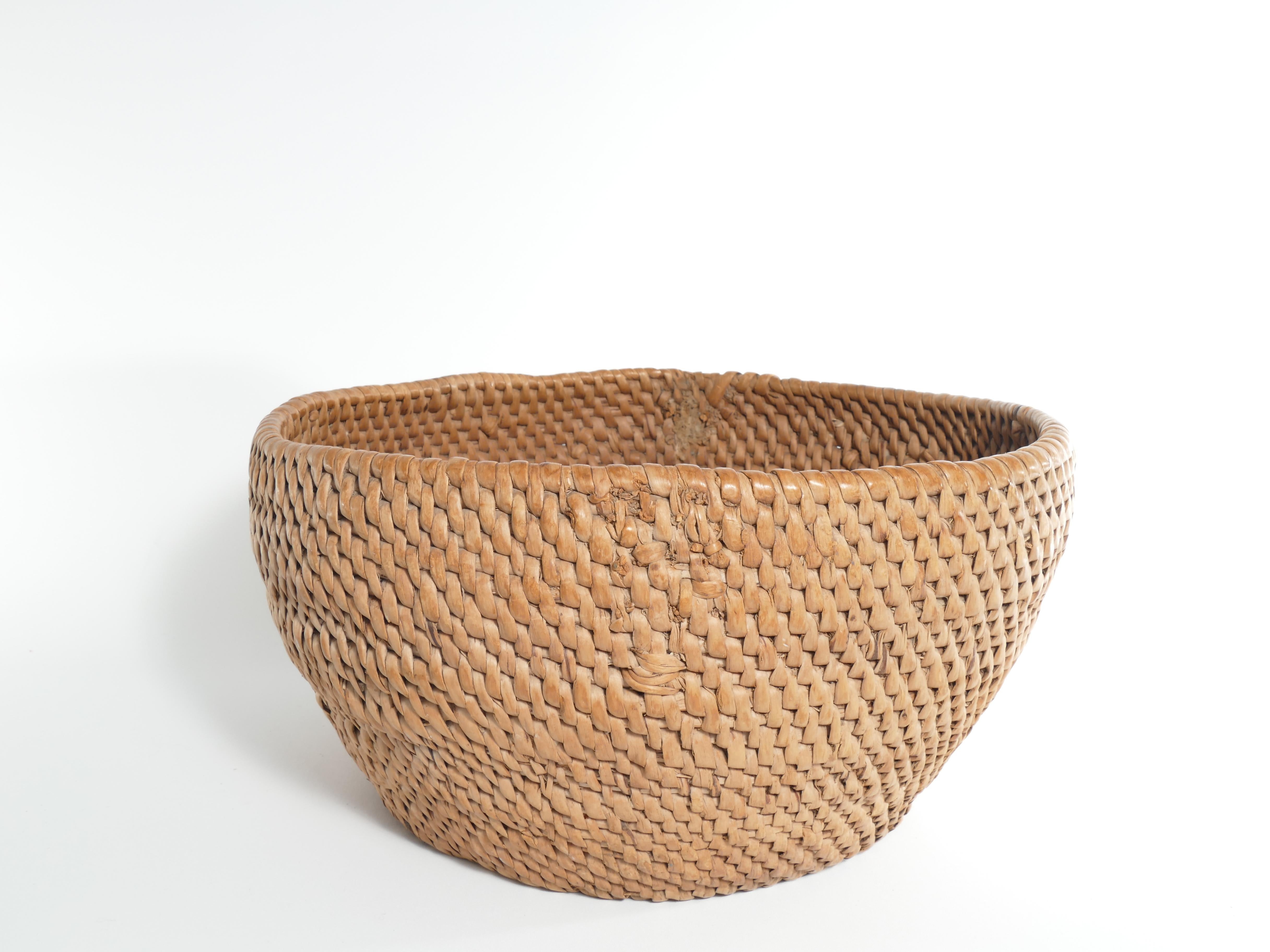 Introducing a remarkable piece of history that transcends time - the exquisite Swedish 19th century root basket. Most likely made of birch root. Immerse yourself in the rich craftsmanship and culture of a bygone era as you lay your eyes upon this