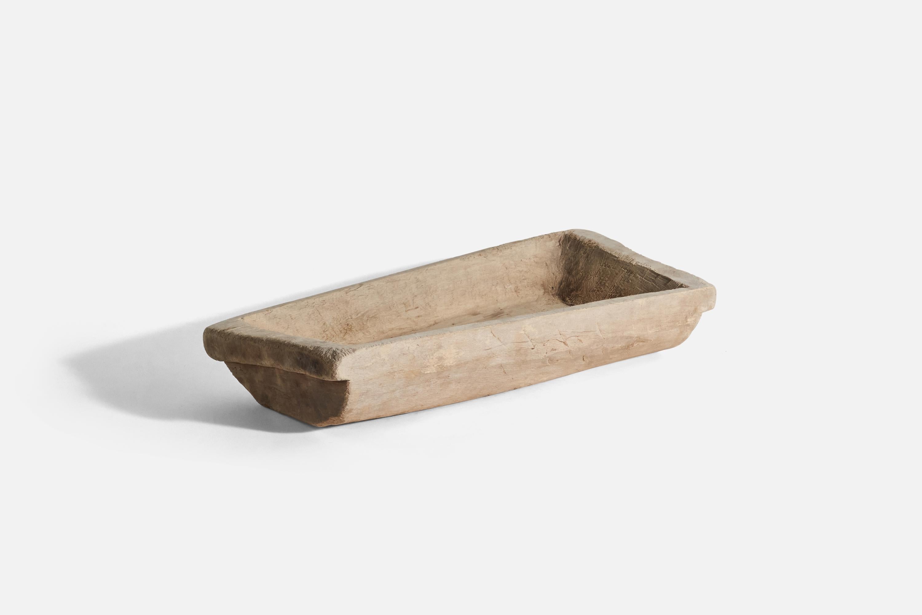 A solid wood, sizeable farmers tray or serving bowl designed and produced in Sweden, circa 1900. 