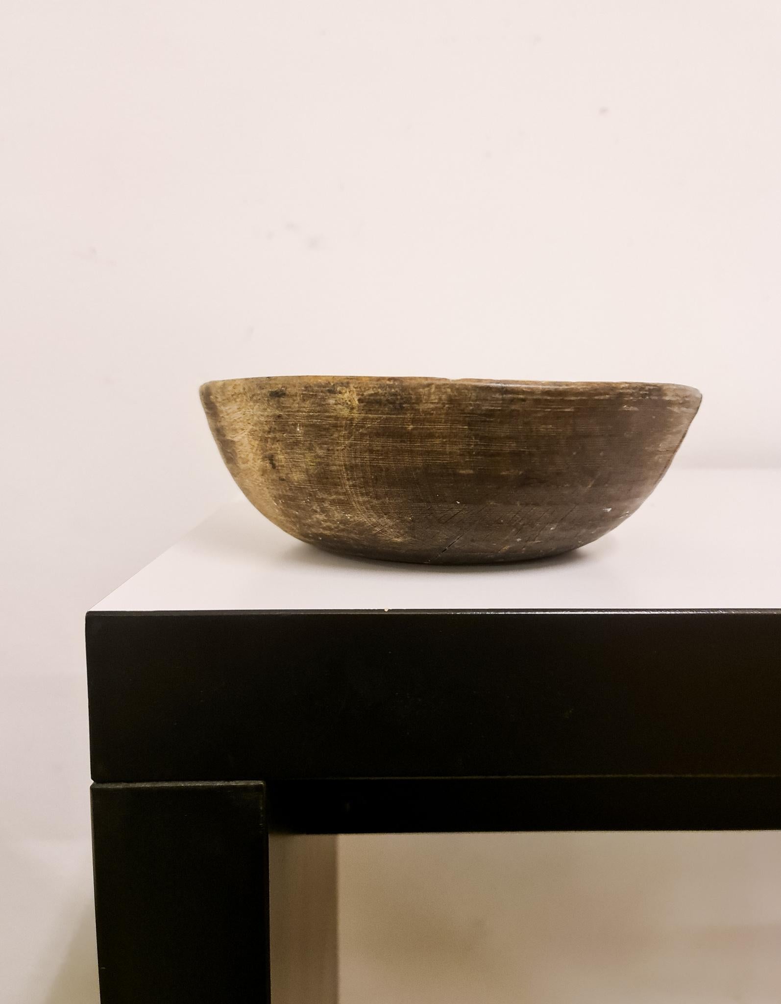 An antique and unique organic wooden bowl. With highly appealing patina, with traces of use. Produced in Sweden, 19th century. 
These bowls where very important for many families; therefore they were passed on from generations. Many of them have a