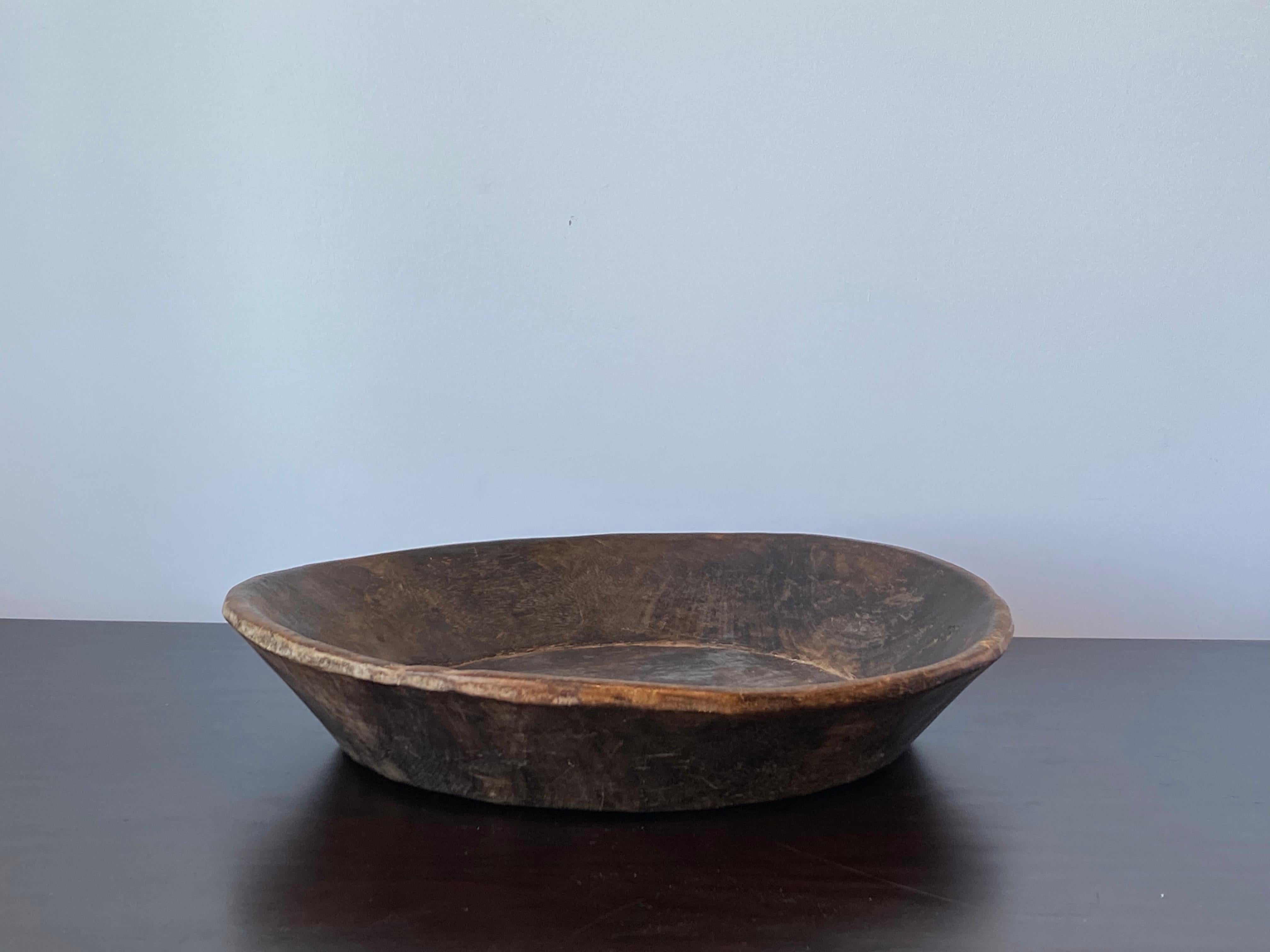 An antique, unique organic and large farmers wooden bowl or dish. With highly appealing patina, produced in Sweden, 19th century.
  