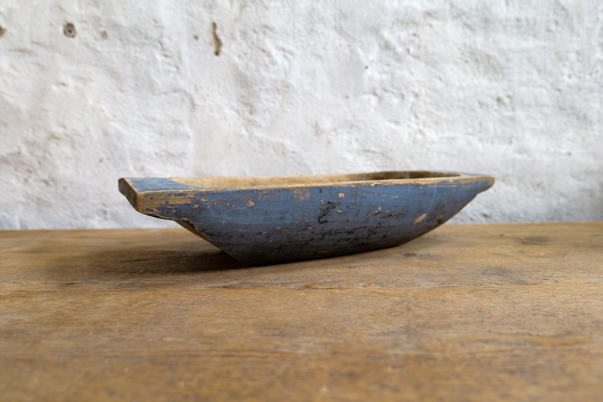 An large antique and unique organic wooden bowl. With highly appealing patina, with traces of use. This one in a unique blue painted color thats been patinated during its time. Produced in Sweden, 19th century. 
These bowls where very important for