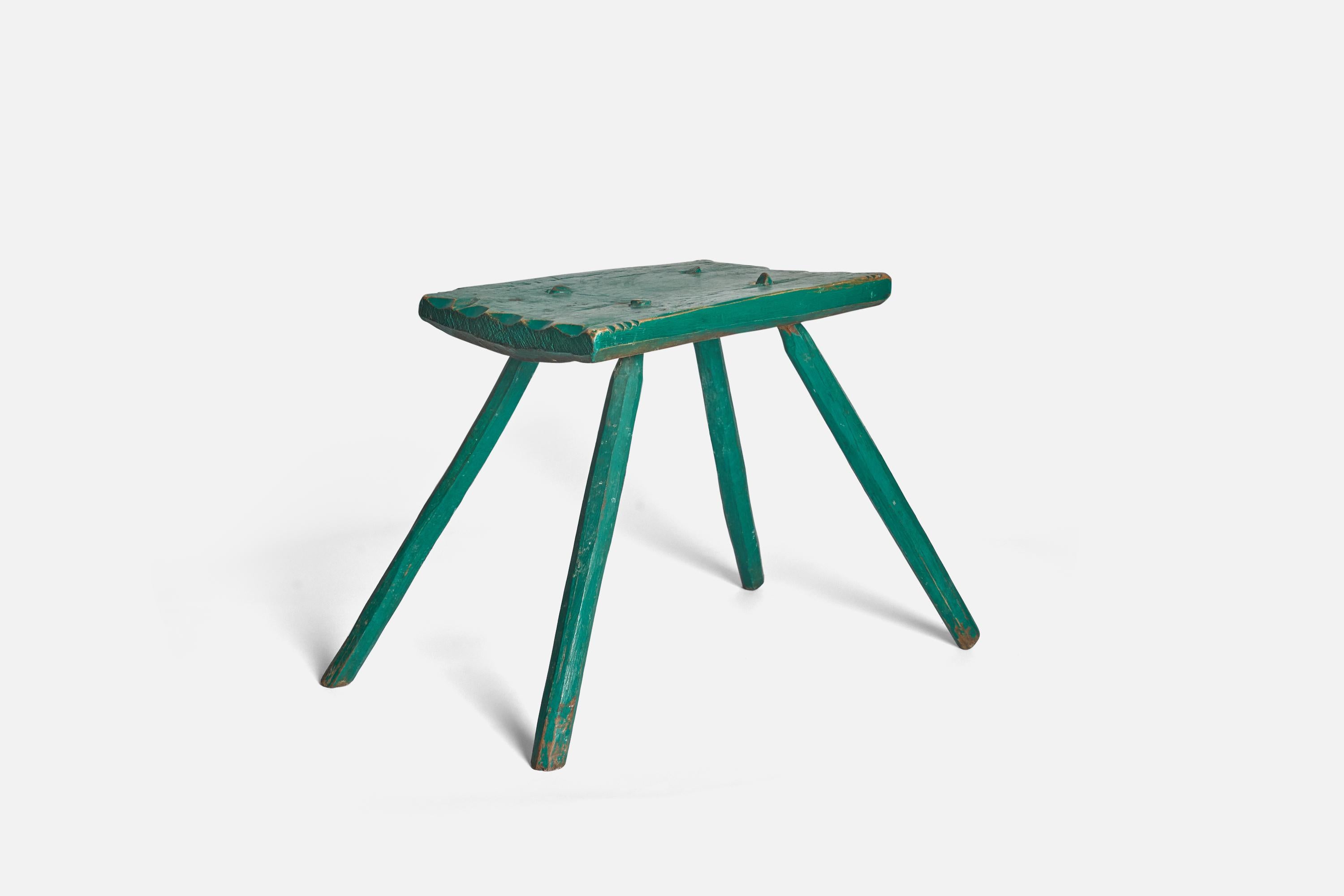 A farmers green-painted wooden stool produced in Sweden, early 19th century. Most likely painted in early 20th century.