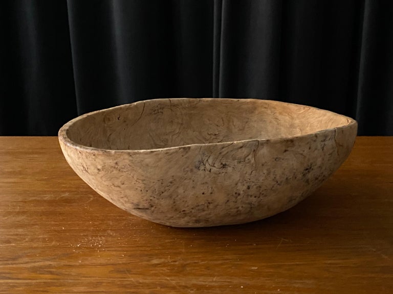 An antique, unique organic and large farmers wooden bowl. With highly appealing patina, Produced in Sweden, 19th century. Signed 