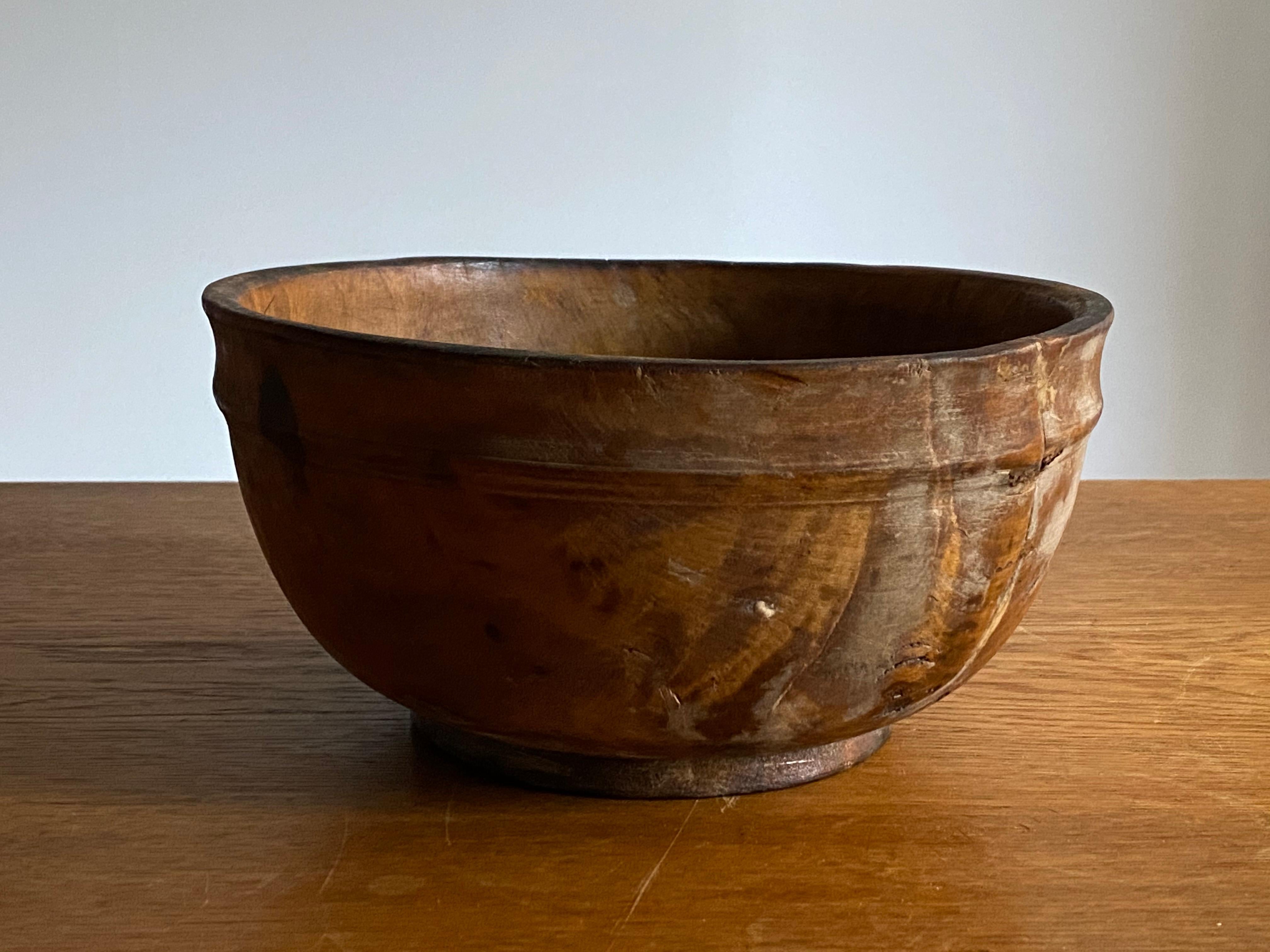 An antique and unique farmers organic wooden bowl. With highly appealing patina, produced in Sweden, 19th century. Features an old and beautiful repair.