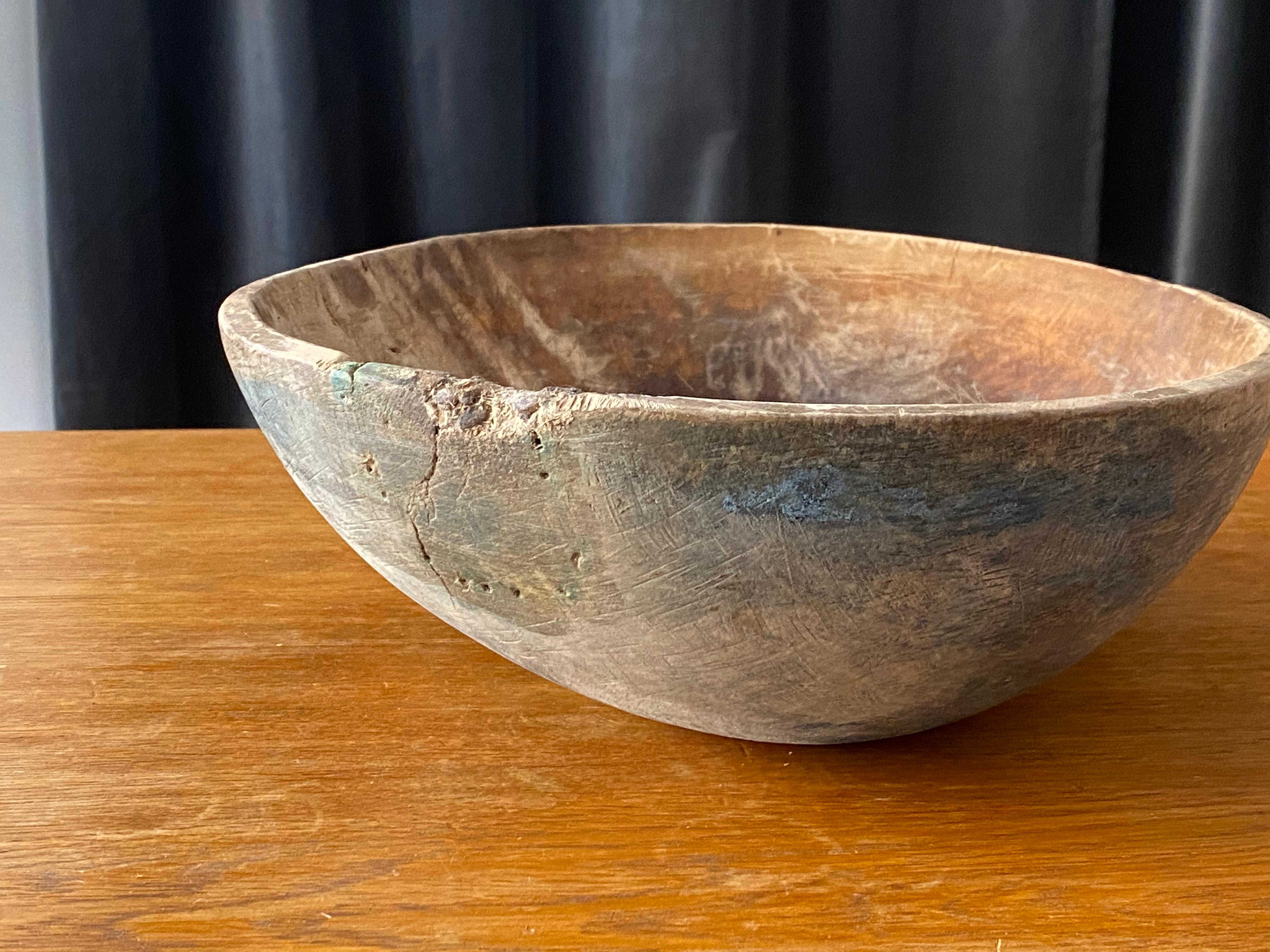 An antique and unique large organic and early farmers wooden bowl. Signed JPS.R.
Produced in Sweden, 18th century. 

      