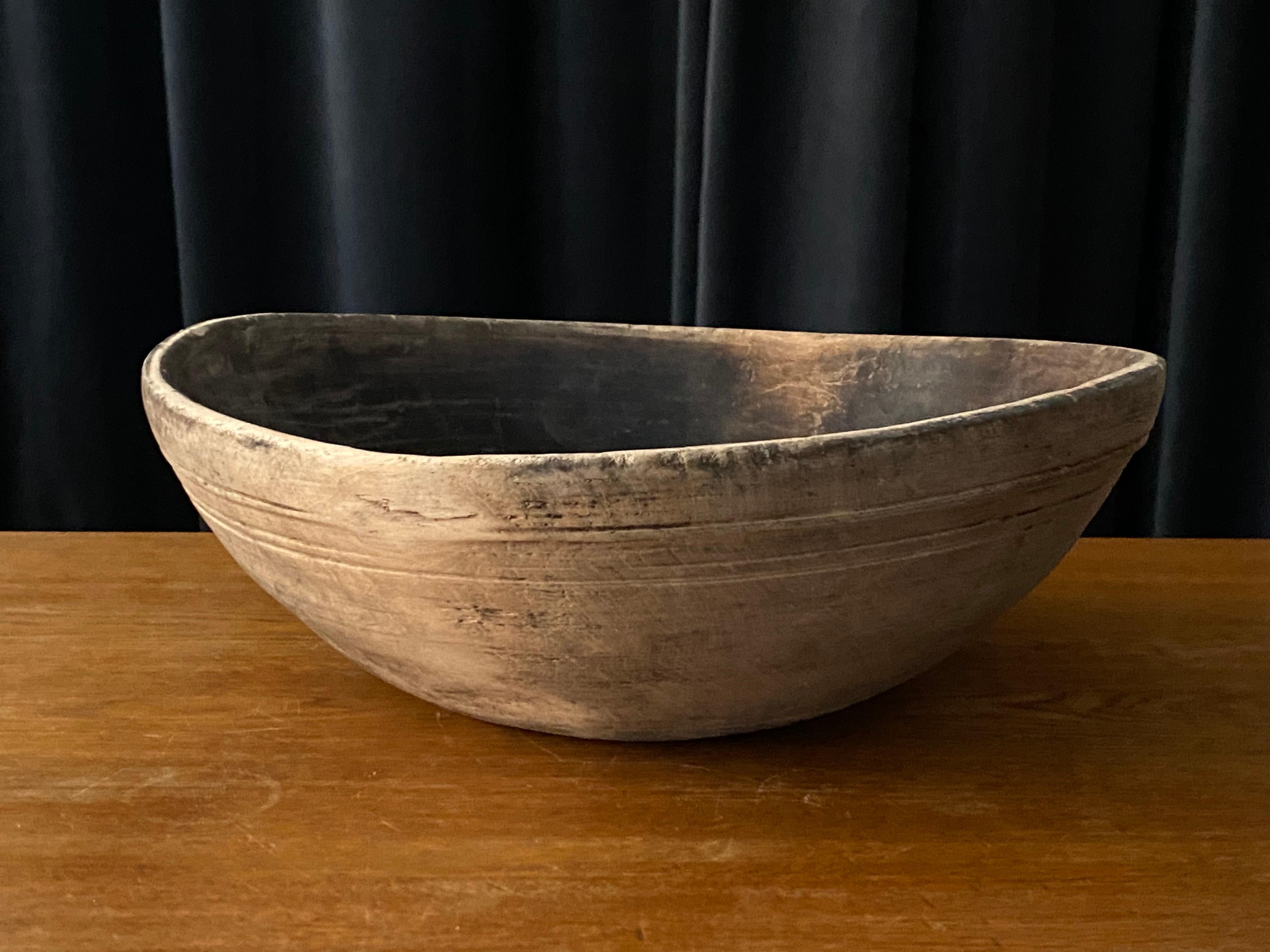 An antique, unique organic and large farmers wooden bowl. With highly appealing patina, Produced in Sweden, 19th century. 
 