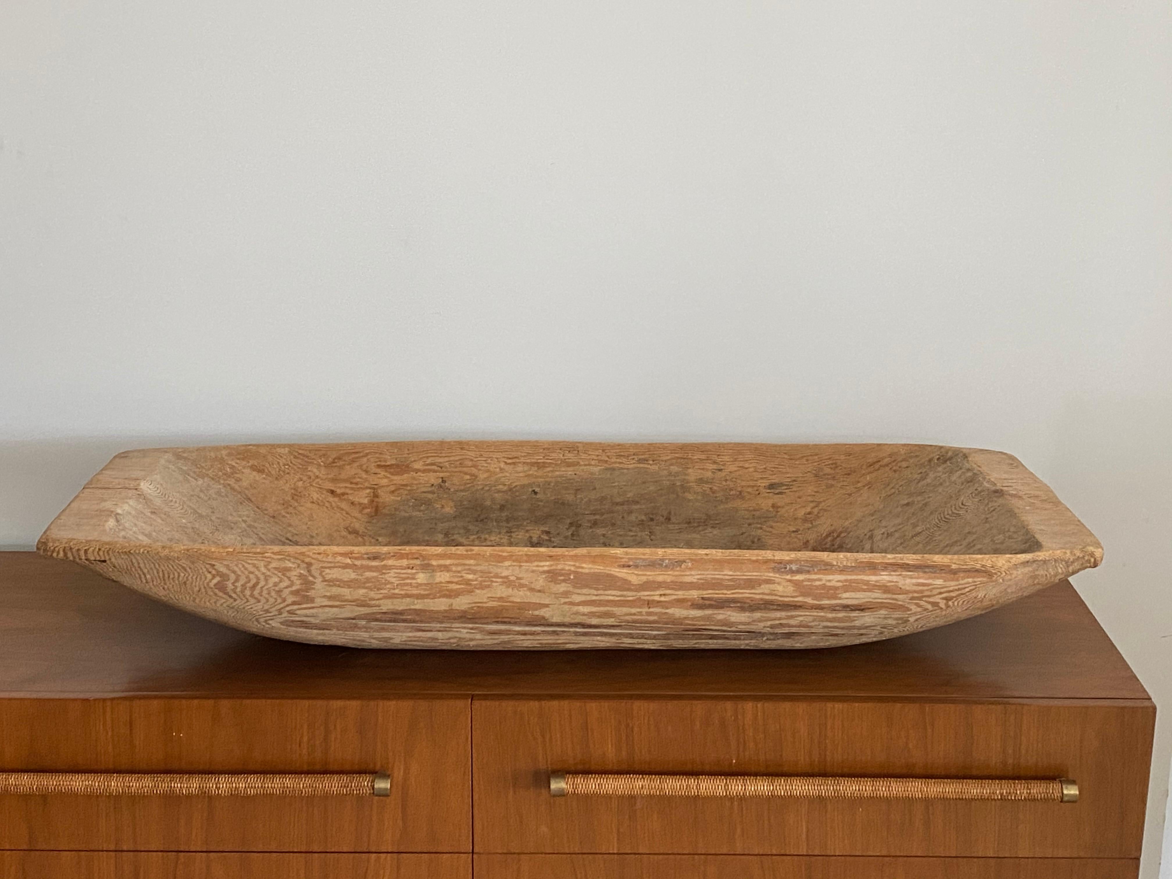 A nearly monumentalyl large farmers handcrafted form or tray / serving bowl or centerpiece. In solid pine wood. A highly functional object with a sculptural appearance.

 