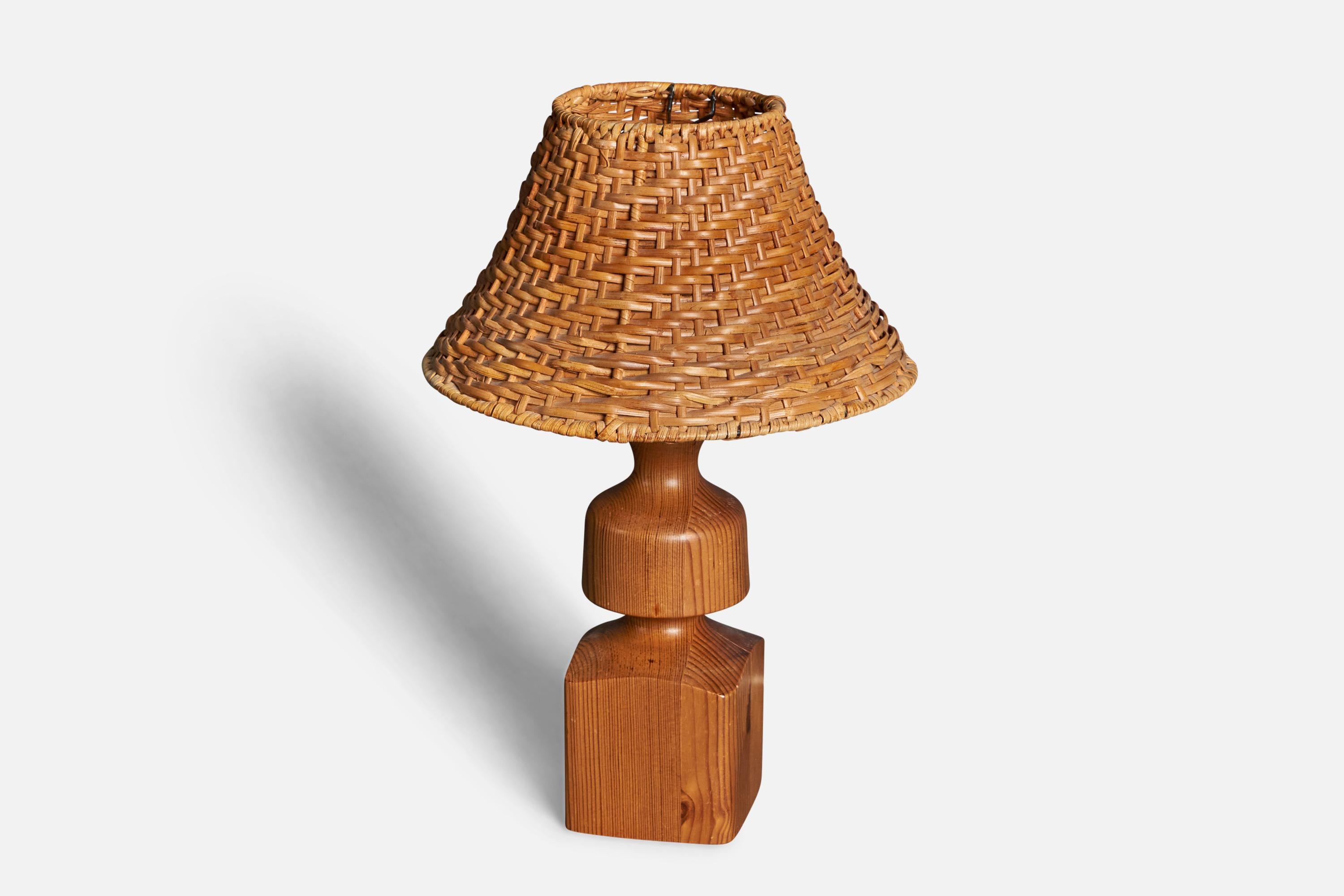 A pair of table lamps designed and produced in Sweden, 1970s. 

Stated dimensions exclude lampshades, height includes socket. Upon request illustrated model rattan lampshade can be included in purchase.