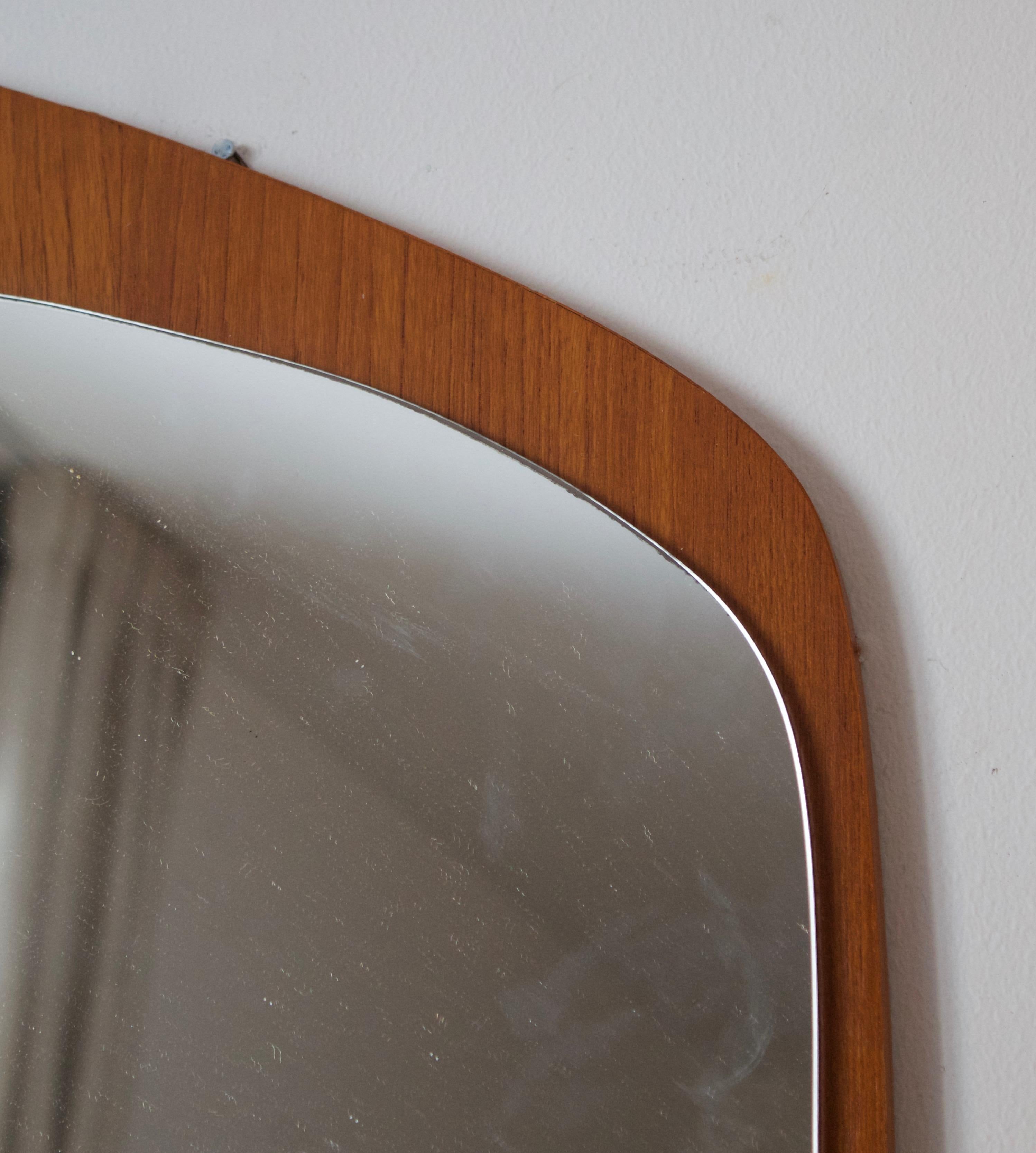 A Swedish organic modern mirror. Original mirror glass mounted on teak frame.

Other designers of the period include Finn Juhl, Campo Graffi, Fontana Arte, Josef Frank, and Hans Agne Jacobsen.