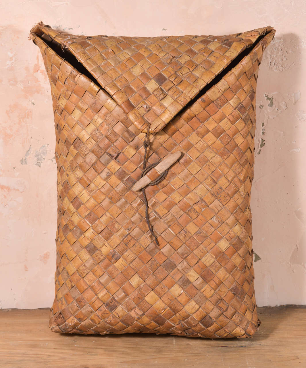 Swedish woven fruit basket: this charming woven construction basket closes with flap secured by leather strap.

Note: Regional differences in humidity and climate during shipping may cause antique and vintage wood to shrink and/or split along its
