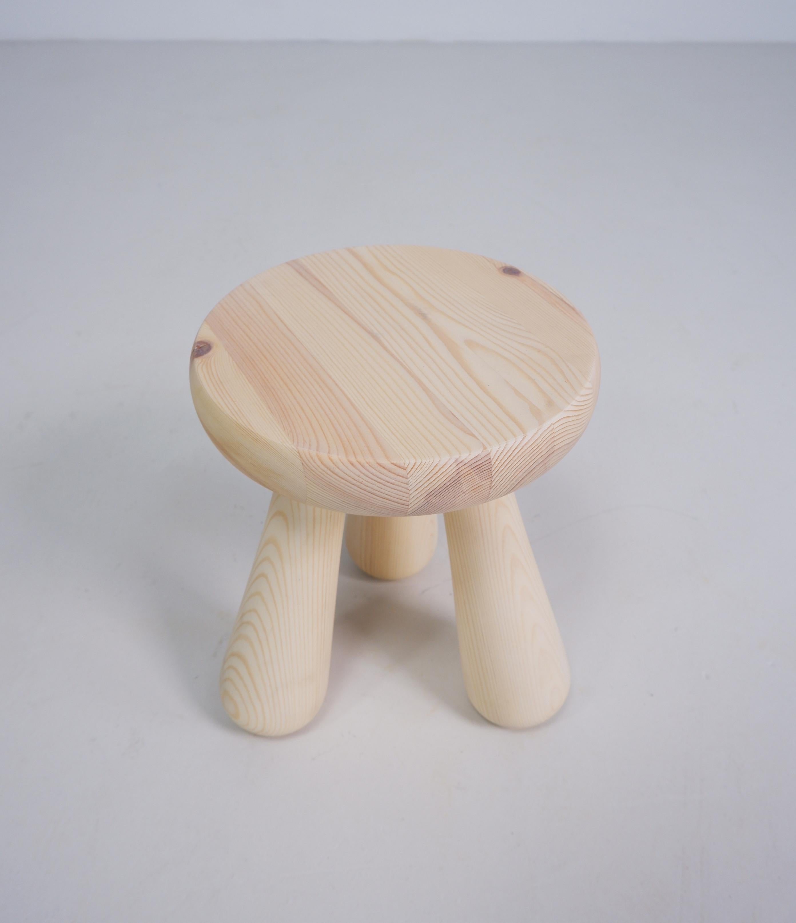 Chunky lime-washed pine Swedish milking stool. Very Ingvar Hildingsson in style.
    
A black stained stool is also available. 