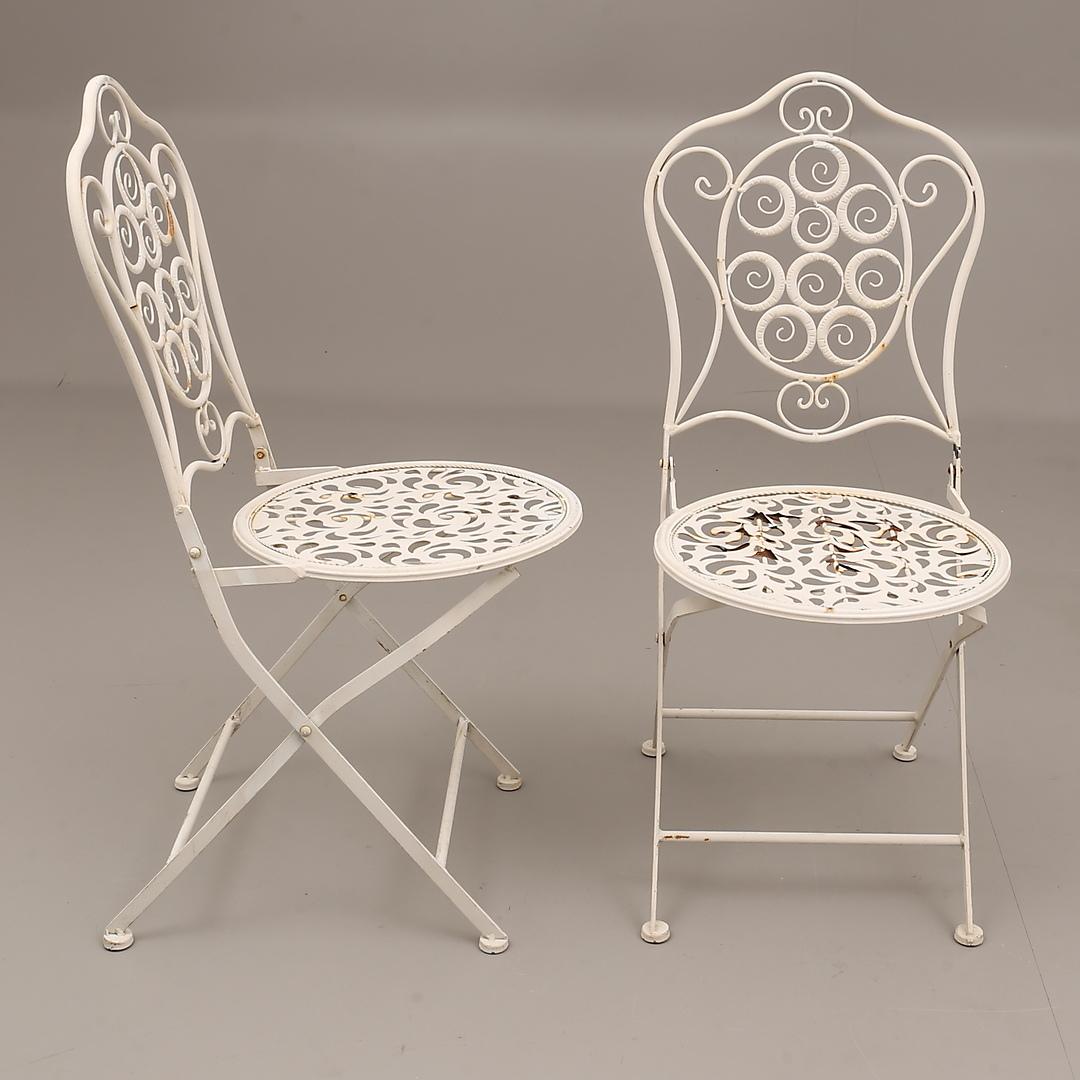 Cast metal painted folding chairs and table made in Sweden in the 1960s.
 