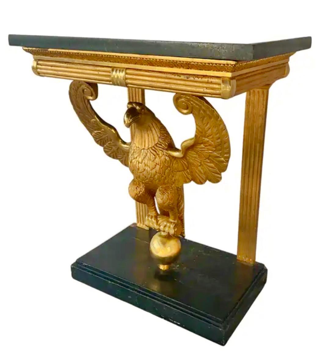 19th Century Swedish Giltwood Neoclassical Console Table. Console is an exceptional example of period decorative arts. Console top is rectangular black stone, and table features a carved giltwood eagle at its center.  Eagle is poised with