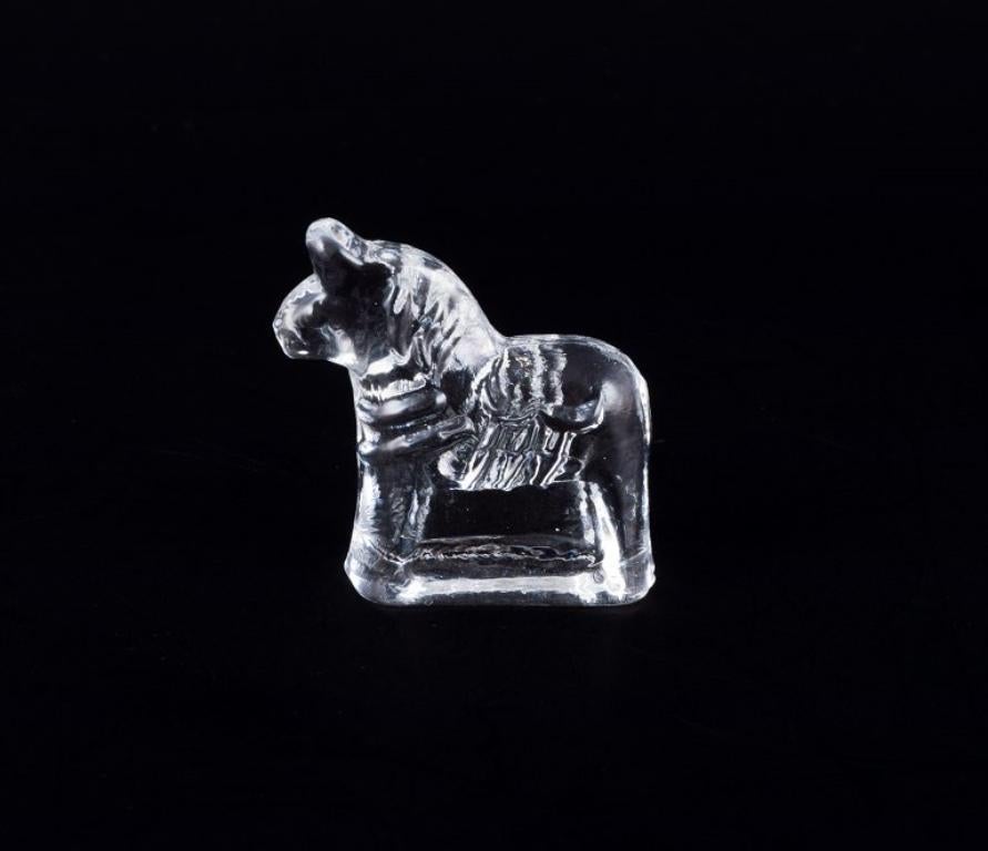 Late 20th Century Swedish glass artist. Four Dala horses in clear mouth-blown art glass. 1970s For Sale