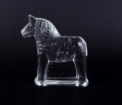 Swedish glass artist. Four Dala horses in clear mouth-blown art glass.