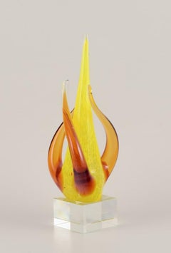 Swedish glass artist. Large sculpture in art glass. Yellow and amber decoration.