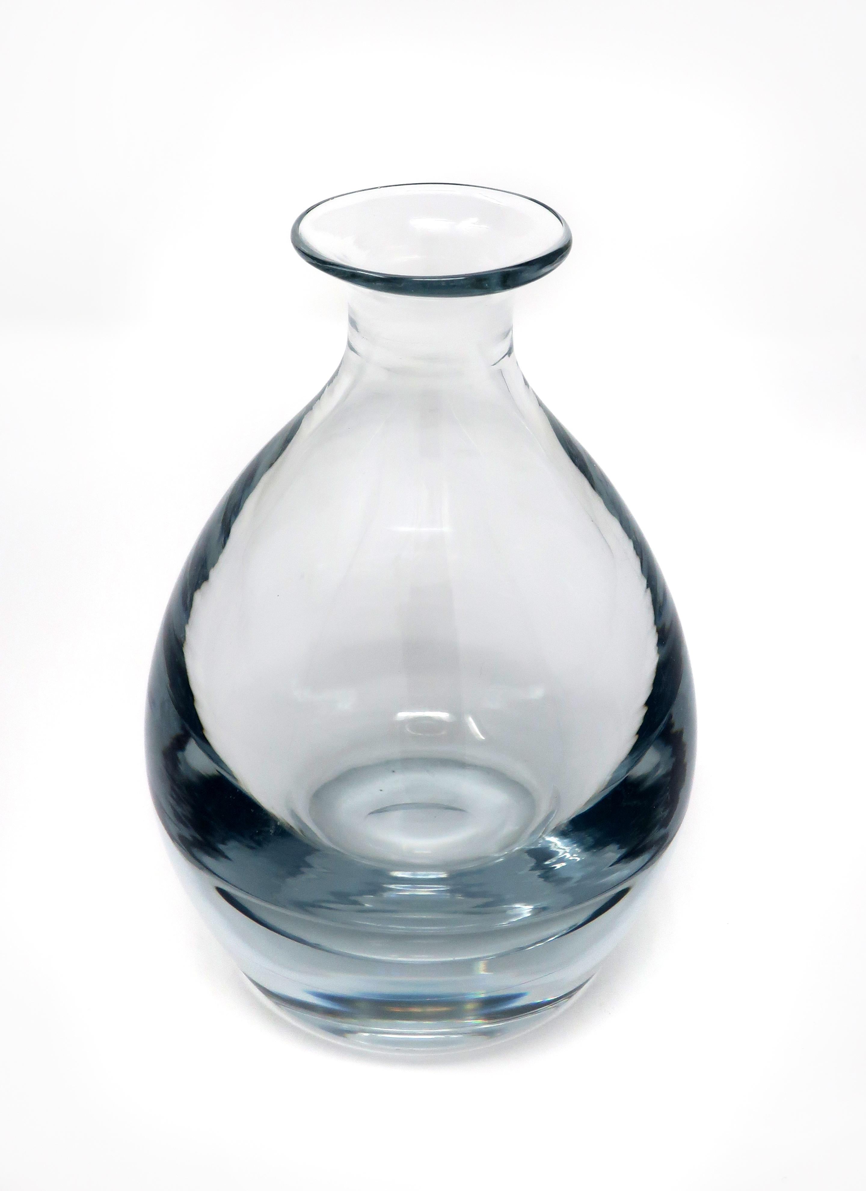 A stunning Scandinavian Modern Strombergshyttan glass vase with wide base, narrow neck, and flared opening. Signed on underside “Stromberg 024”. In excellent vintage condition.

Measures: 4