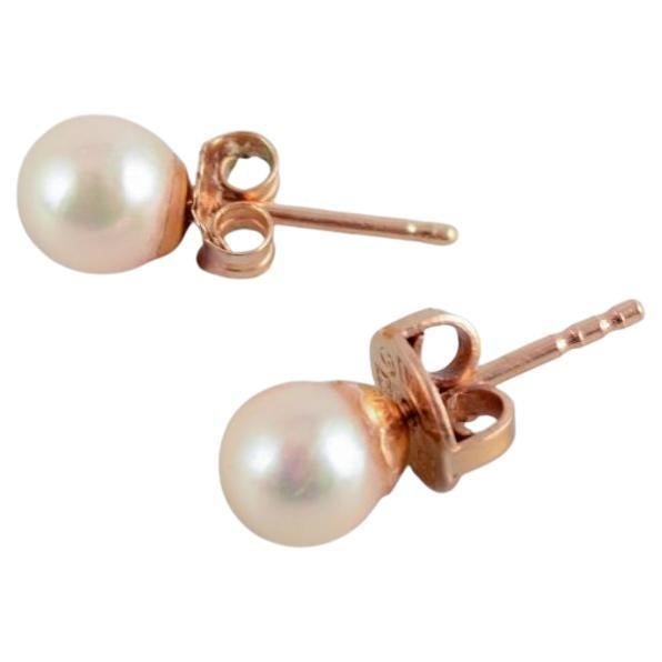 Swedish goldsmith. A pair of ear studs in gold with cultured pearls. Mid-20th C.