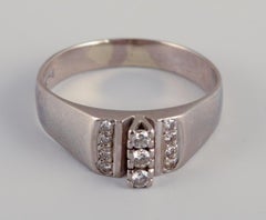 Swedish goldsmith. Ring in 18-karat white gold adorned with eleven diamonds.