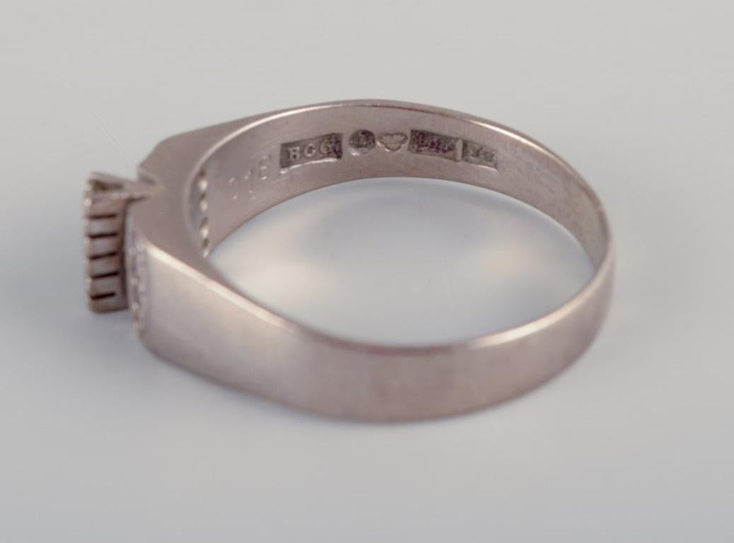 Swedish goldsmith. Ring in 18-karat white gold adorned with eleven diamonds. For Sale 1