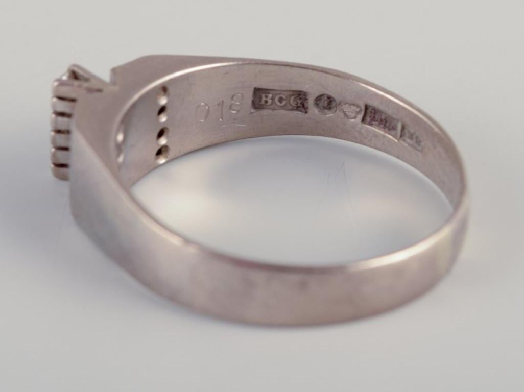 Swedish goldsmith. Ring in 18-karat white gold adorned with eleven diamonds. For Sale 2