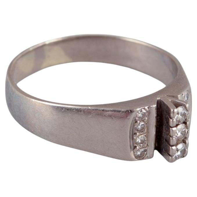 Swedish goldsmith. Ring in 18-karat white gold adorned with eleven diamonds. For Sale