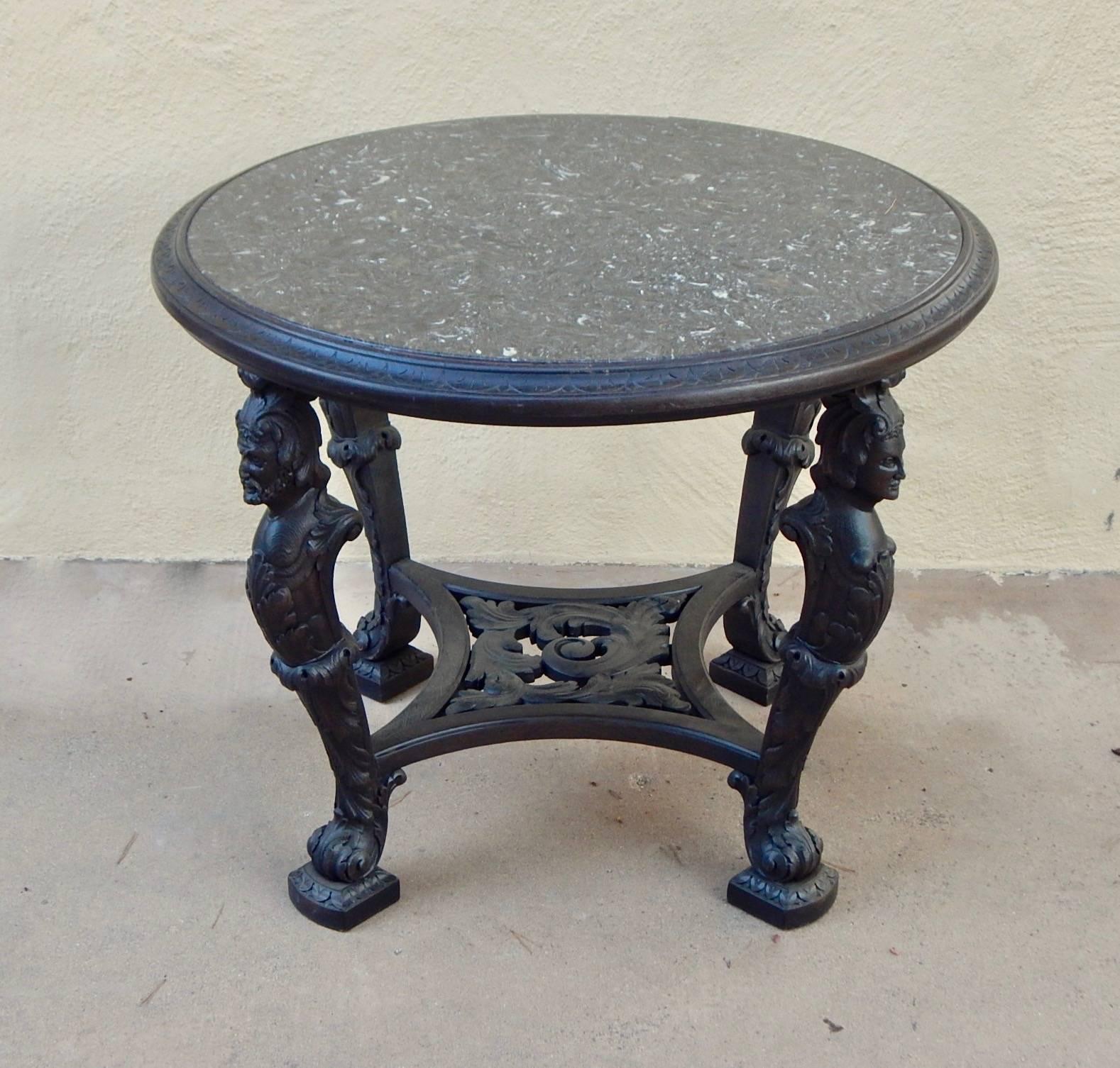 Swedish Gothic Revival table rendered in birch wood with four distinct figural columns.
Wood is in a gray/ebony finish. Wood has just been restored. The stone top is recently crafted. In excellent condition. Made in Sweden, circa 1920.
