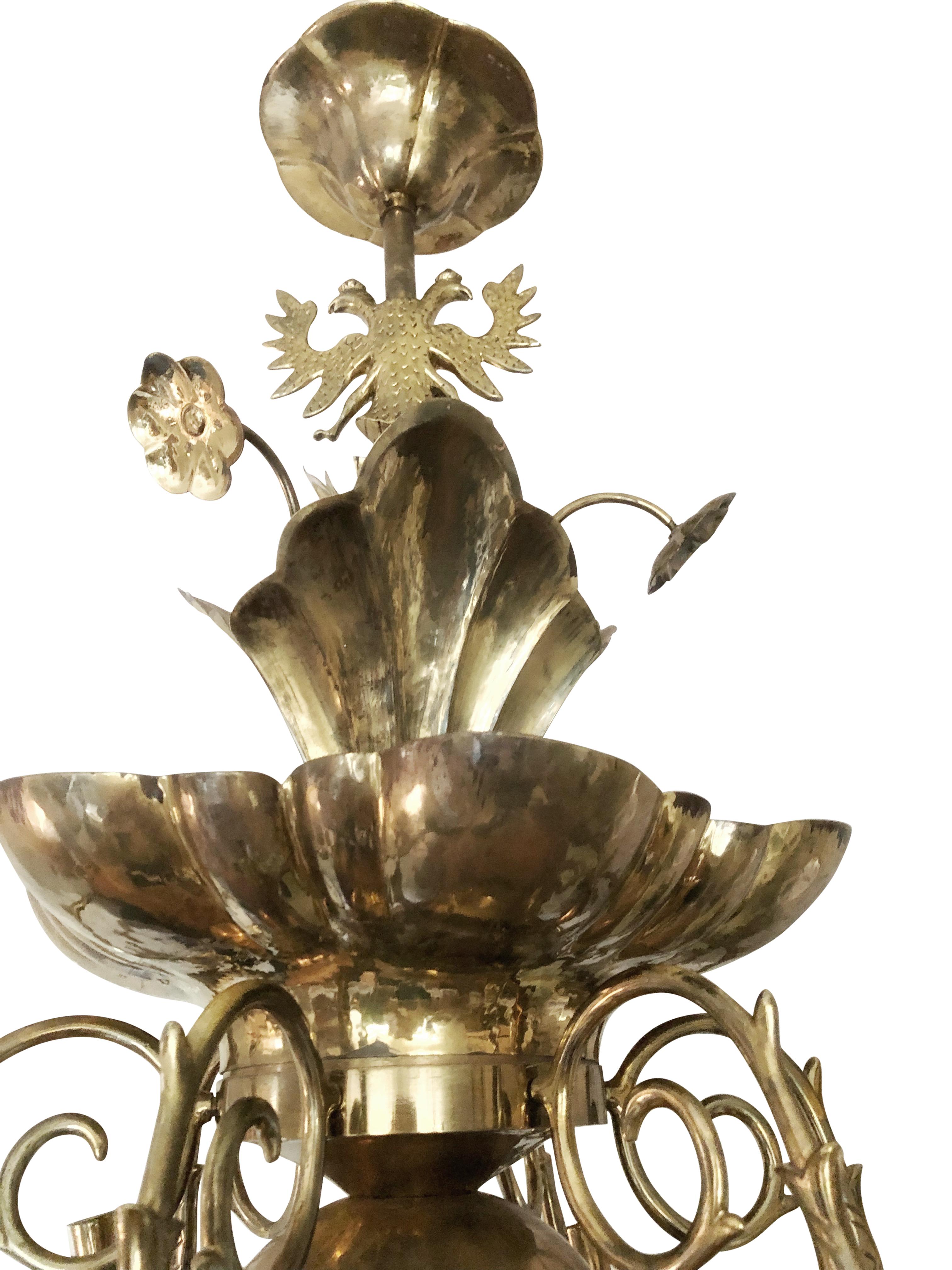 Rare Arvika hand-hammered six-armed brass chandelier made by Sten Johansson for Firma Lars Holmström, Arvika, Sweden.
Six candelabra sockets and six candle light holders.
Arvika stamp.
The chandelier needs new electricity. One lamp holder is