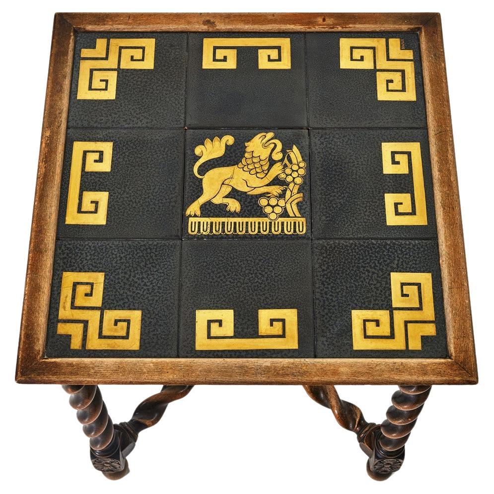 Rare Art Deco piece, coffee table with beautiful spiral legs made of red beech and black tiles with gold motif. 

Dimensions for this table with turned legs of red beech is H 56 x W50 x W50cm. Tiles have a gilded pattern with a lion in the middle,