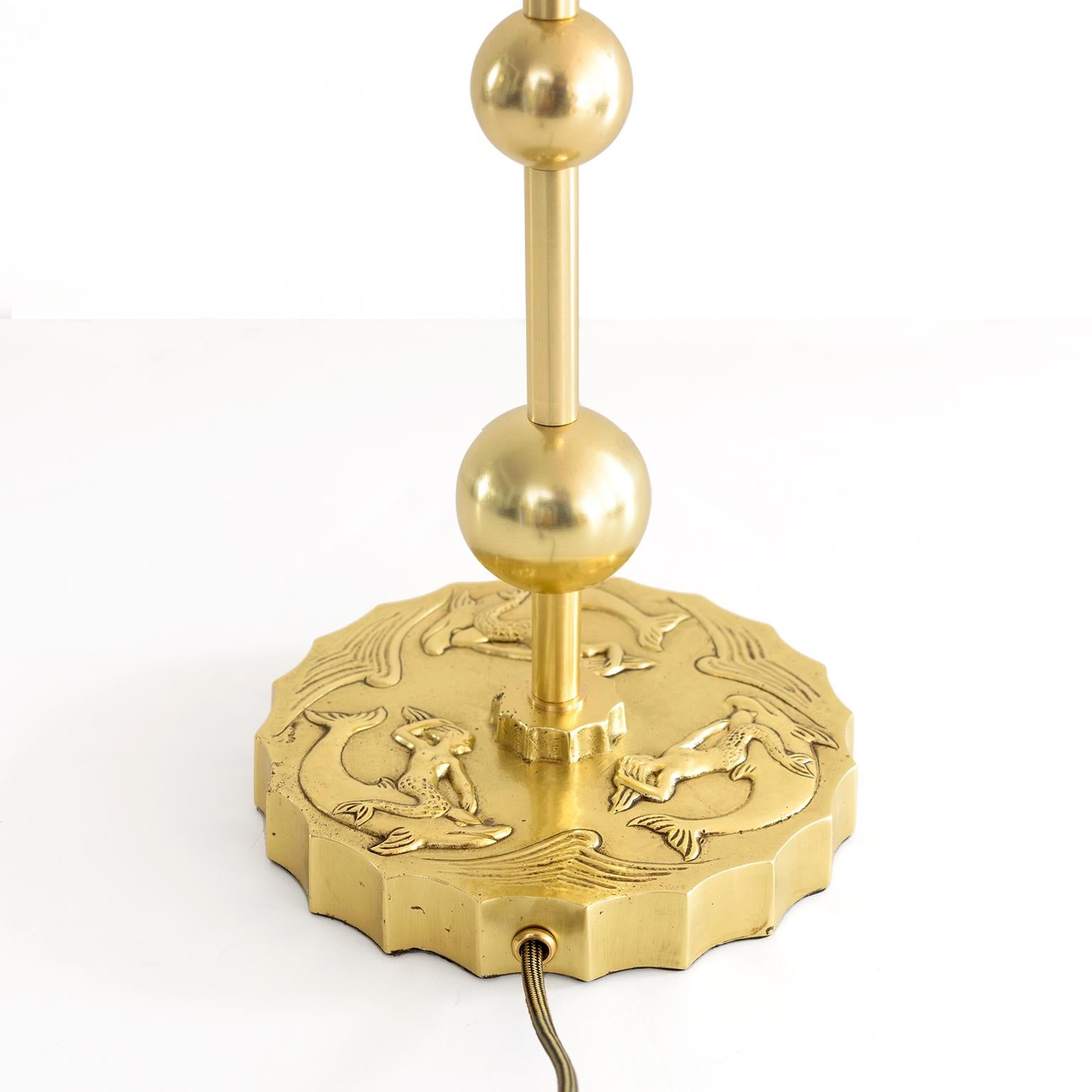 Mid-20th Century Swedish Grace Brass Table Lamp with Mermaids and Dolphins in Relief For Sale