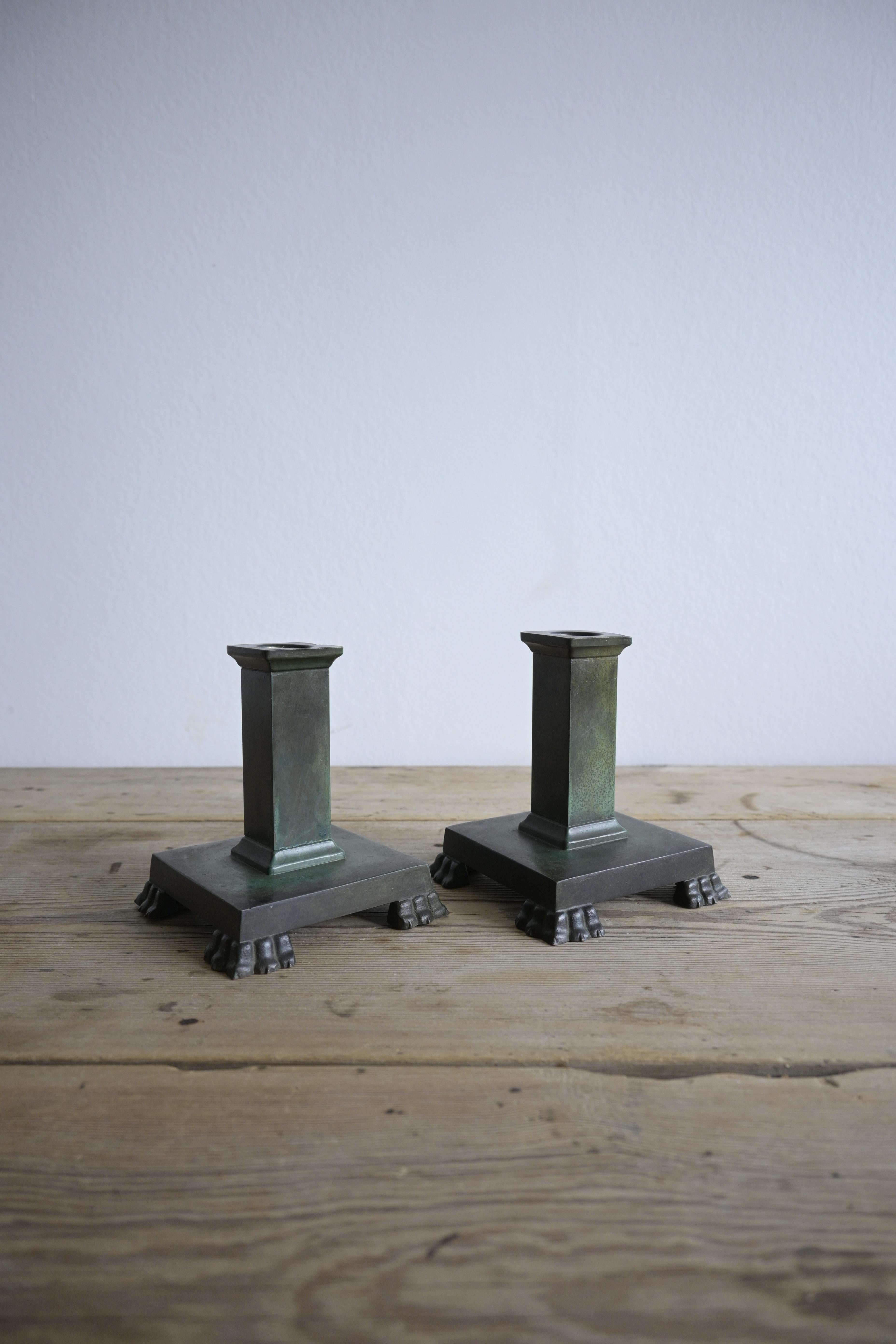 Swedish Grace Bronze Candlesticks 1920-30s

Made by GAB Guldsmedsaktiebolaget Brons, Model Number 117, in Sweden.

With their heavy bronze construction, green oxidation, and lion feet, these candlesticks create a subtle and soft presence.

Height: