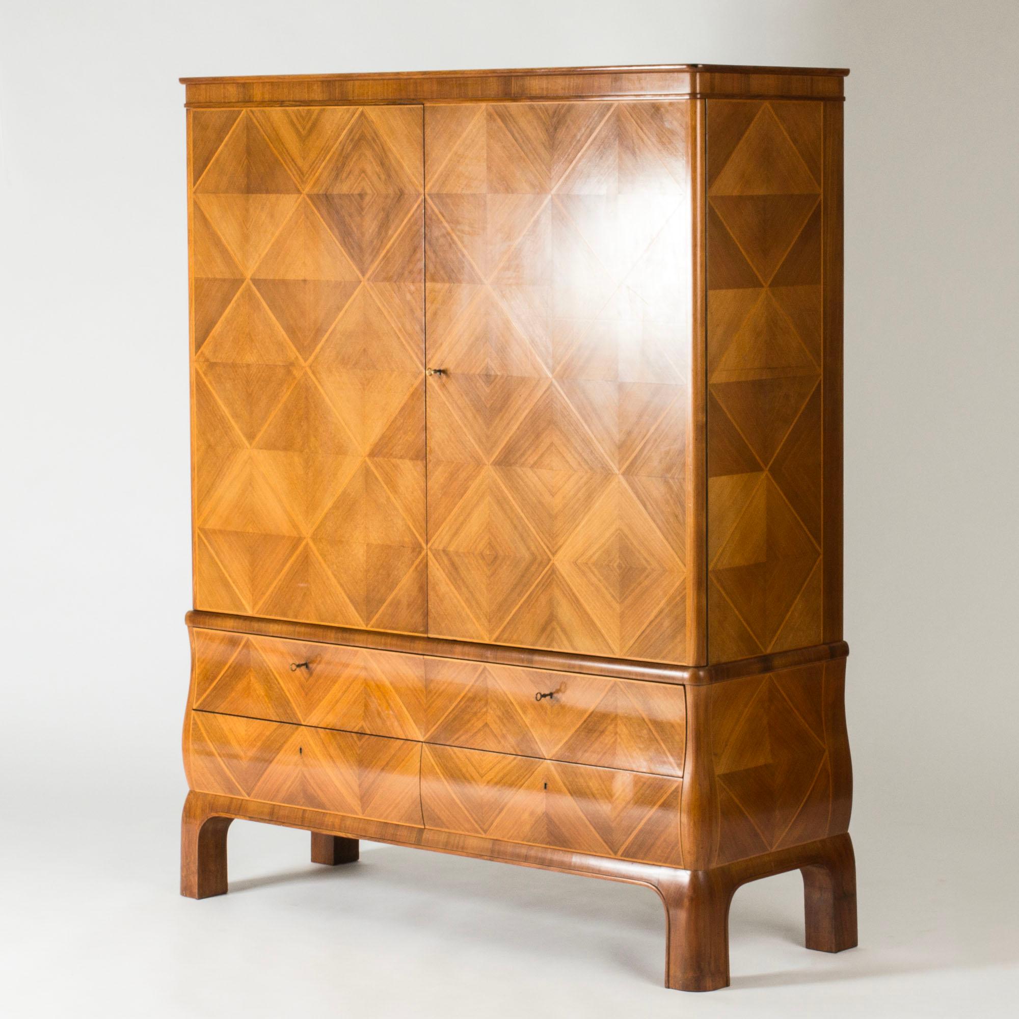 Striking Swedish Grace cabinet from Mobilia, design attributed to Oscar Nilsson who worked as a designer there at the time of its production. Made from mahogany with a beautiful diamond pattern.