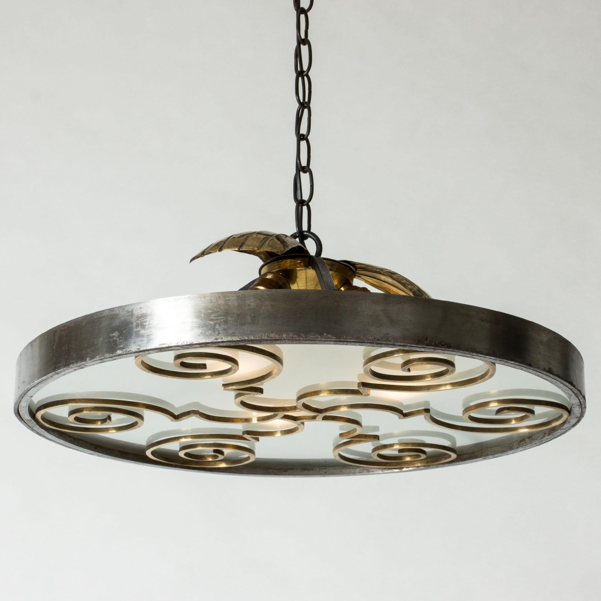 Beautiful Swedish Grace ceiling light in a large size. Made from bronze with a large, wide frosted glass shade. Elaborate, sculptural decor of a man, woman and a deer in stylized foliage. Lovely attention to detail.