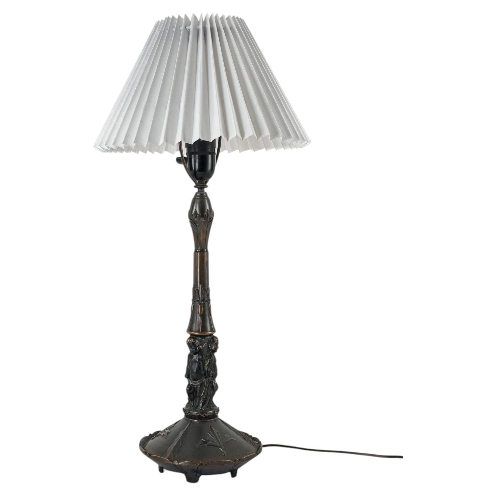 Swedish Grace Figural Table Lamp, Patinated Metal, Sweden, 1920s For Sale