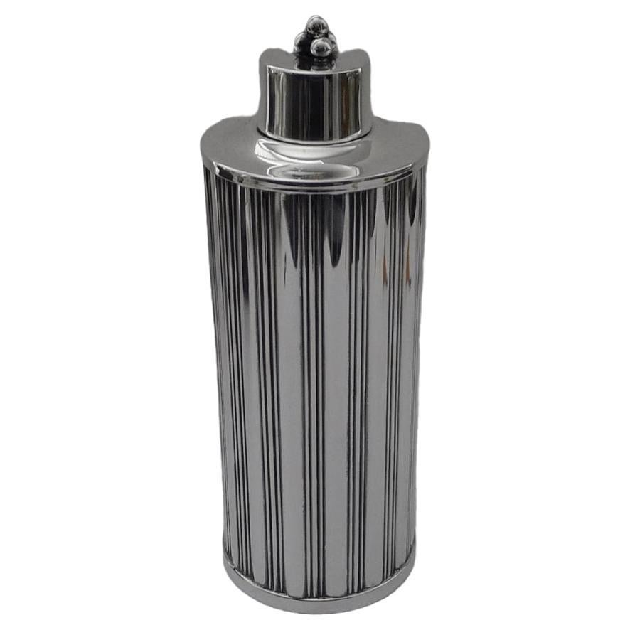 For this elegant silver cocktail shaker known as Swedish Grace, Tage Gothlin took an Art Deco approach that works seamlessly with the high modernist trends of the time.
The shaker is composed of a beautiful cylindrical can reminiscent of an early