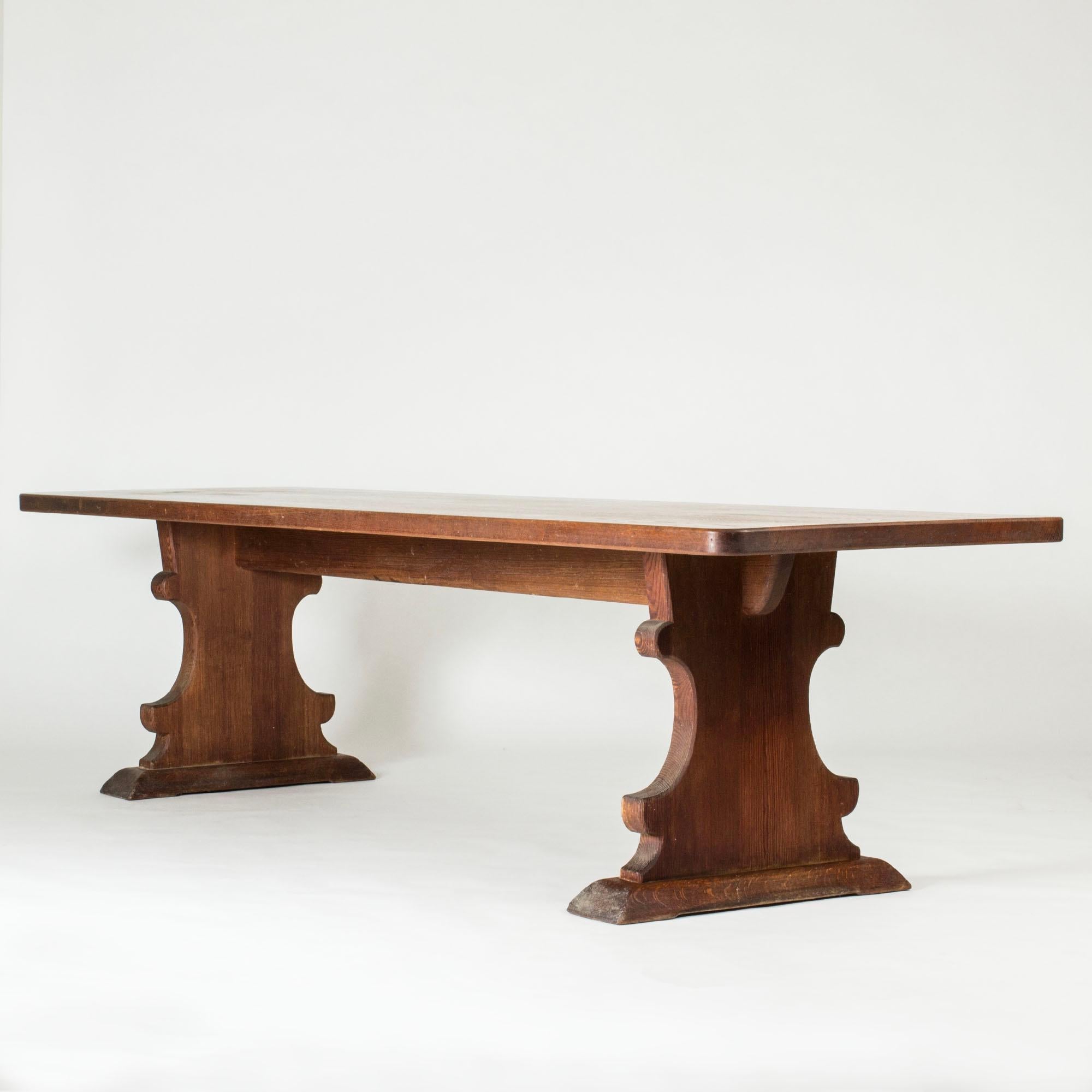 Striking dining table from the Swedish Grace period, made from oak in a rustic, luxurious design. Oversized, seats 12-14 people comfortably. According to the original owners, the table was custom made for their house in south Sweden, by the