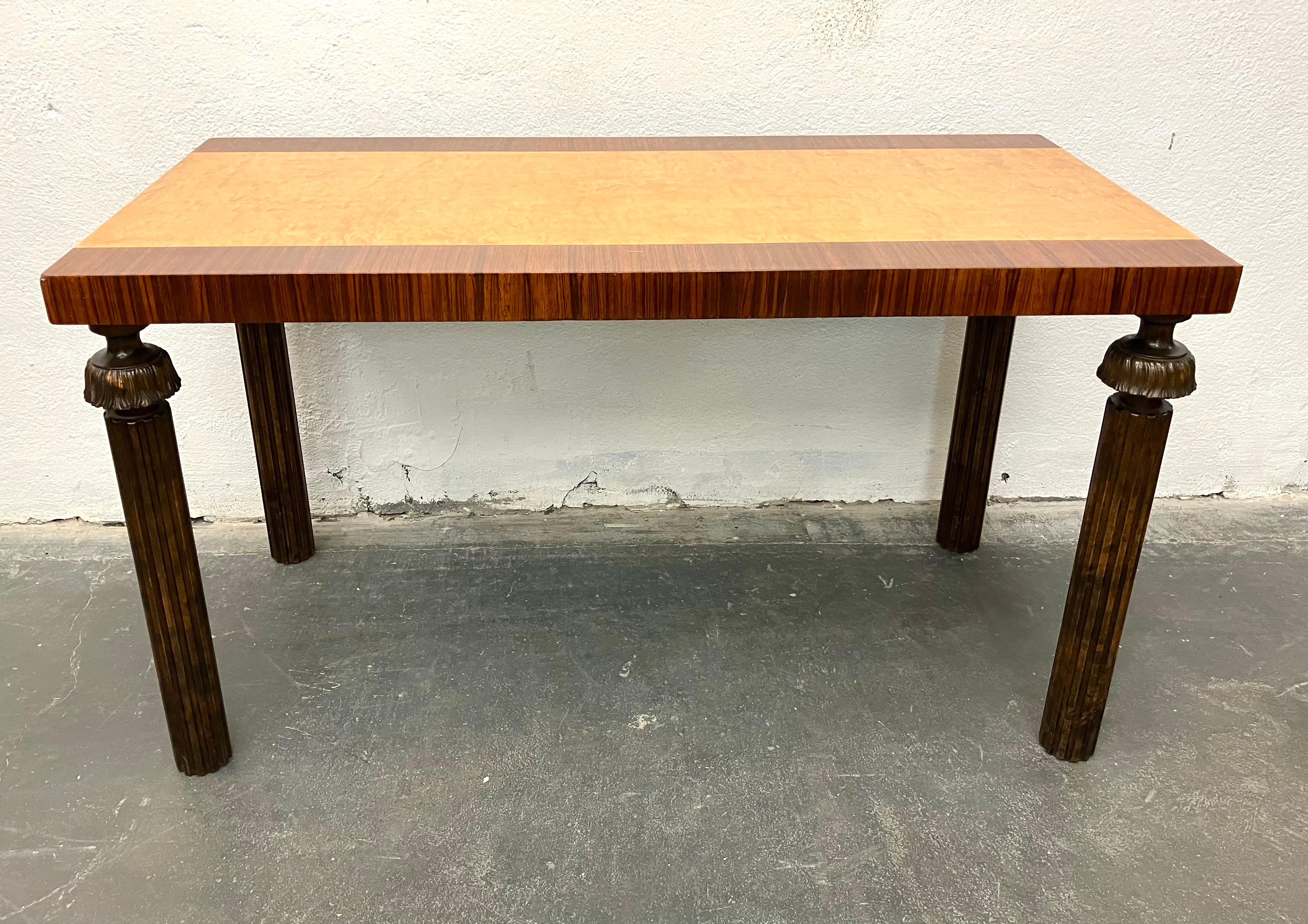 Sweden, the burl maple top with zebra wood banding, raised on dark stained birch carved column legs, circa 1920.