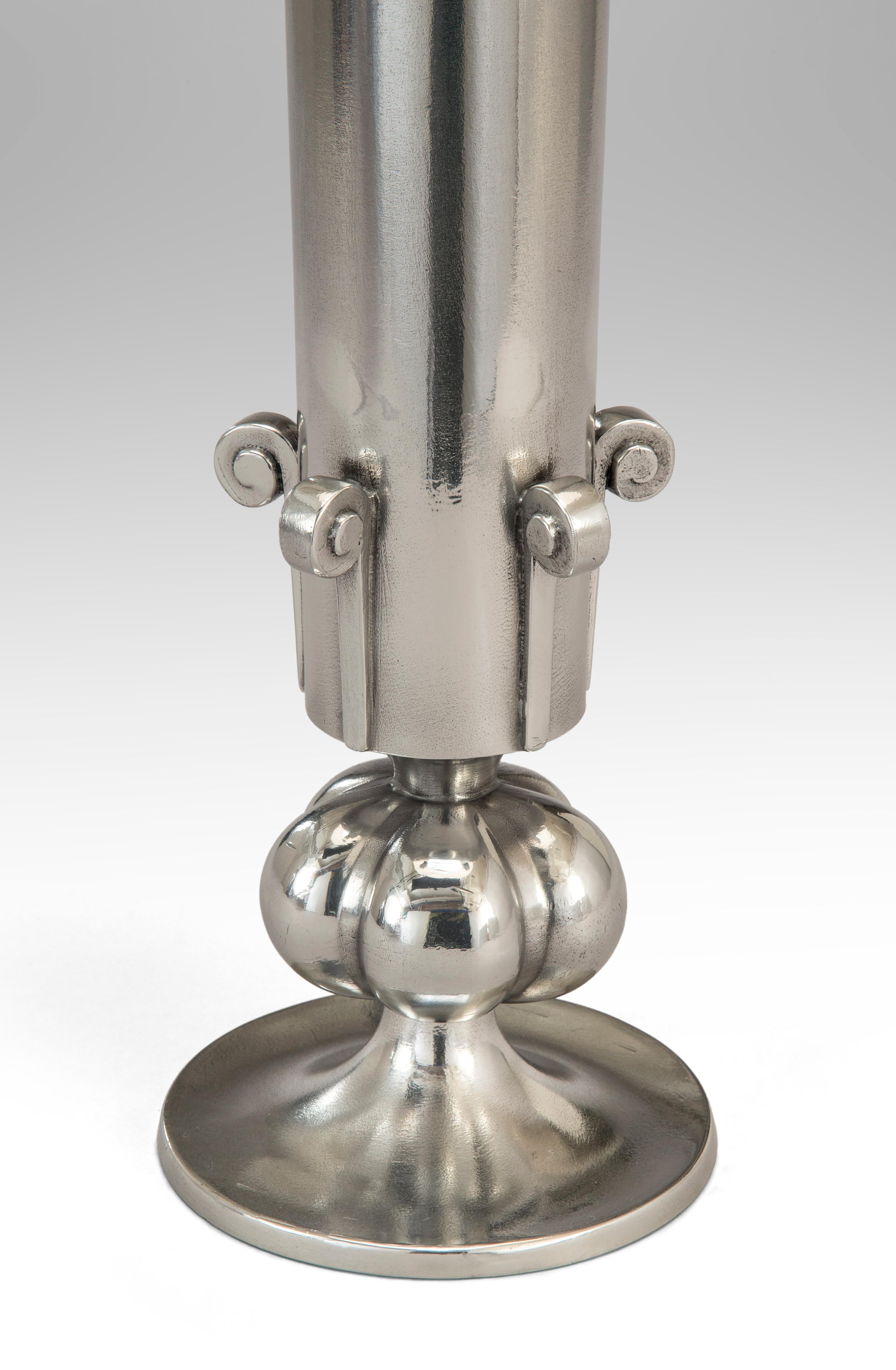 Swedish Grace period pewter lamp
Early 20th century
A strong and elegant design superbly executed. The flared tapering cylinder stem adorned with scrolls above a lobed sphere, on a circular base.
Designers mark: OLLERS
Schreuder & Olsson mark: