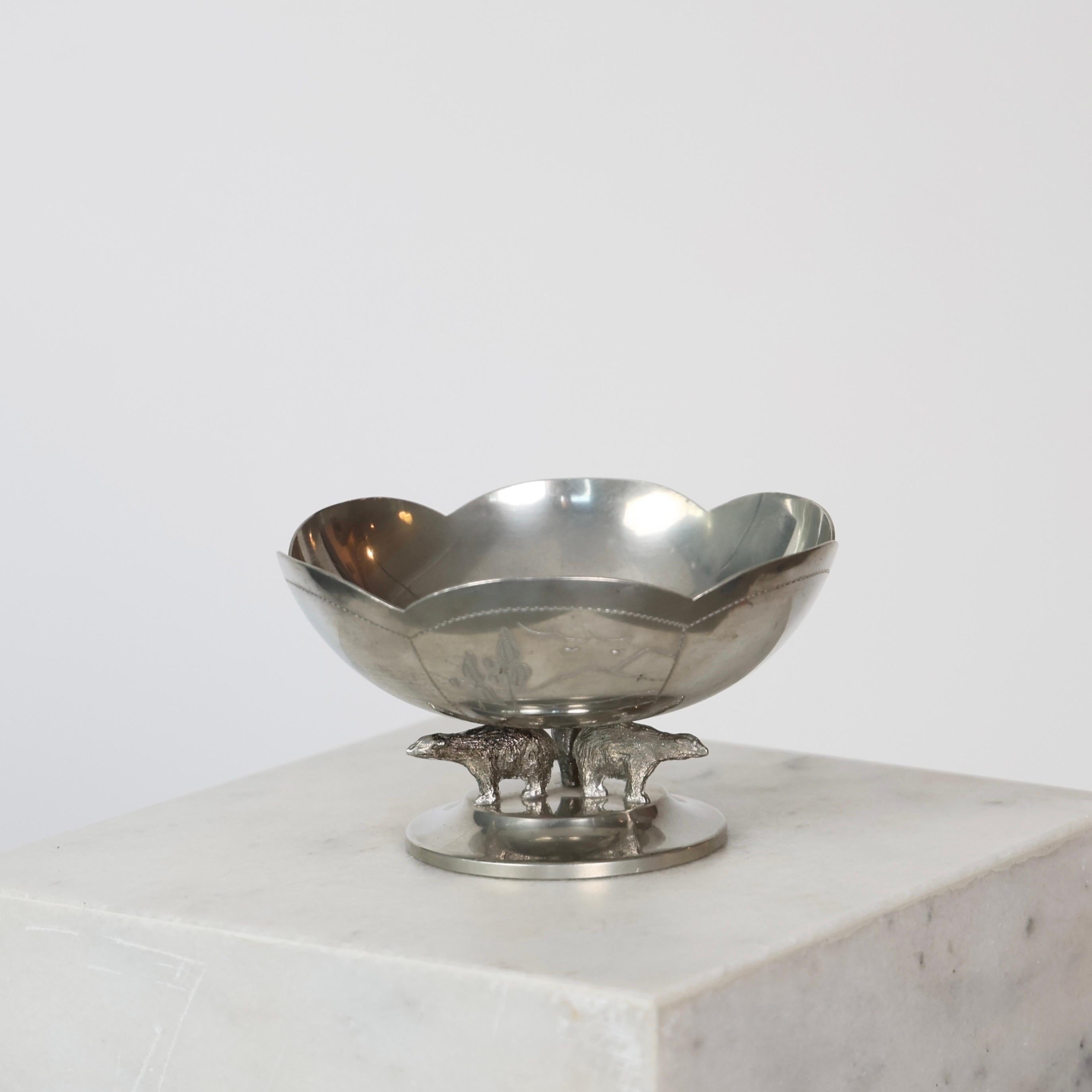 Swedish Grace Pewter Bowl on Foot with Polar Bears made by Lundin & Lindberg in 1930s. 

* Pewter Bowl on Foot with Polar Bears
* Designer: Lundin & Lindberg
* Country: Sweden
* Year: 1932
* Condition: Good vintage condition. Makers engravings