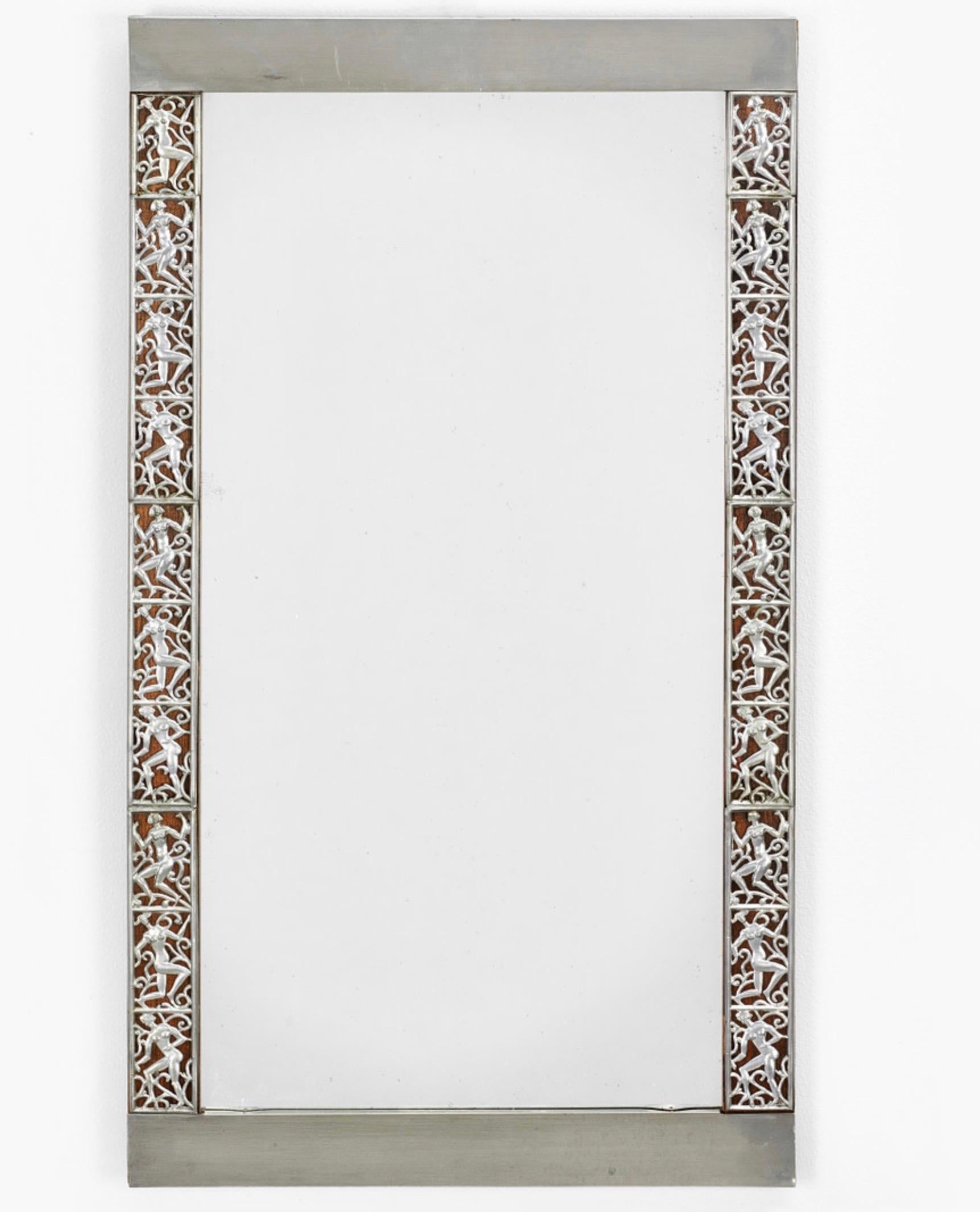 A small Swedish Grace mirror with a pewter-frame depicting dancing women in rectangular frames. Designed by David Wretling (1901-1986).