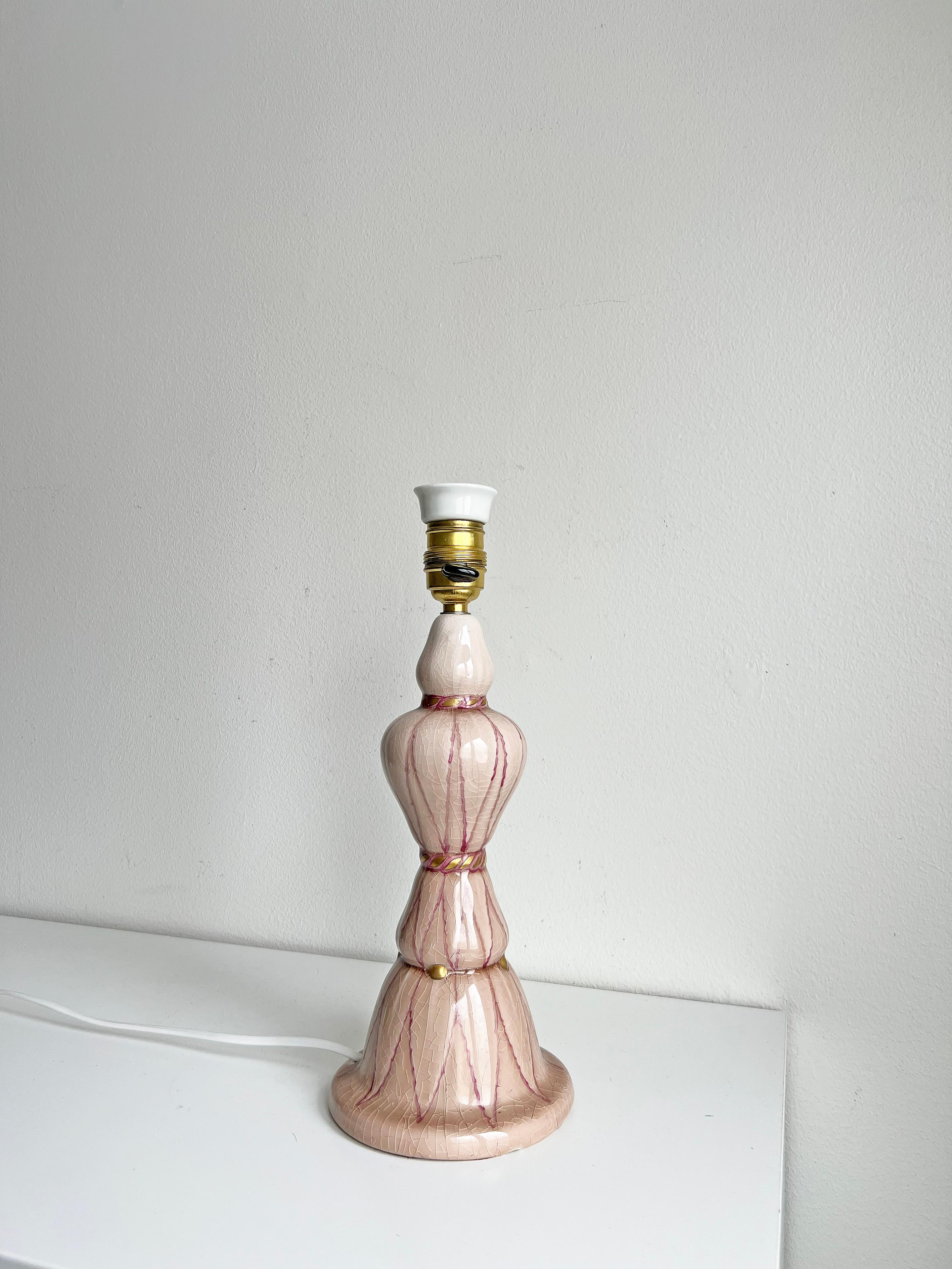 Beautiful and rare swedish grace pink ceramic table lamp by Louise Adelborg for Rörstrand, ca 1920s -1930s with the original shade.
Signed with makers mark.
Height without the shade: 35.5 cm.
Diameter of the shade: ca 38.5 cm

Please note that