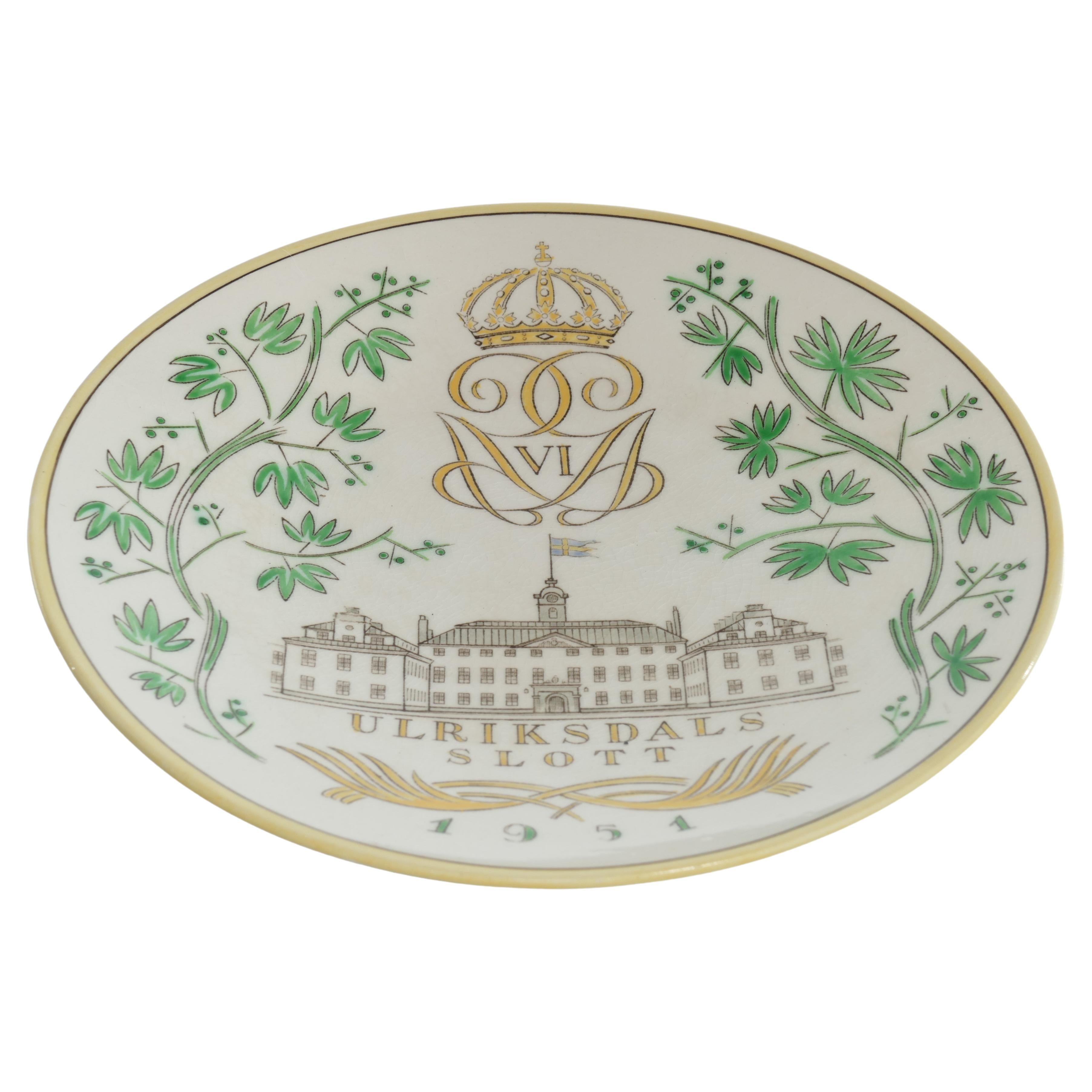 Two stoneware plates depicting the Swedish castle Ulriksdal Palace designed by Arthur Percy and produced by Gefle porslinsfabrik, in 1951.

The pale yellow and green colors, together with the lovely illustration is really capturing the feel of the