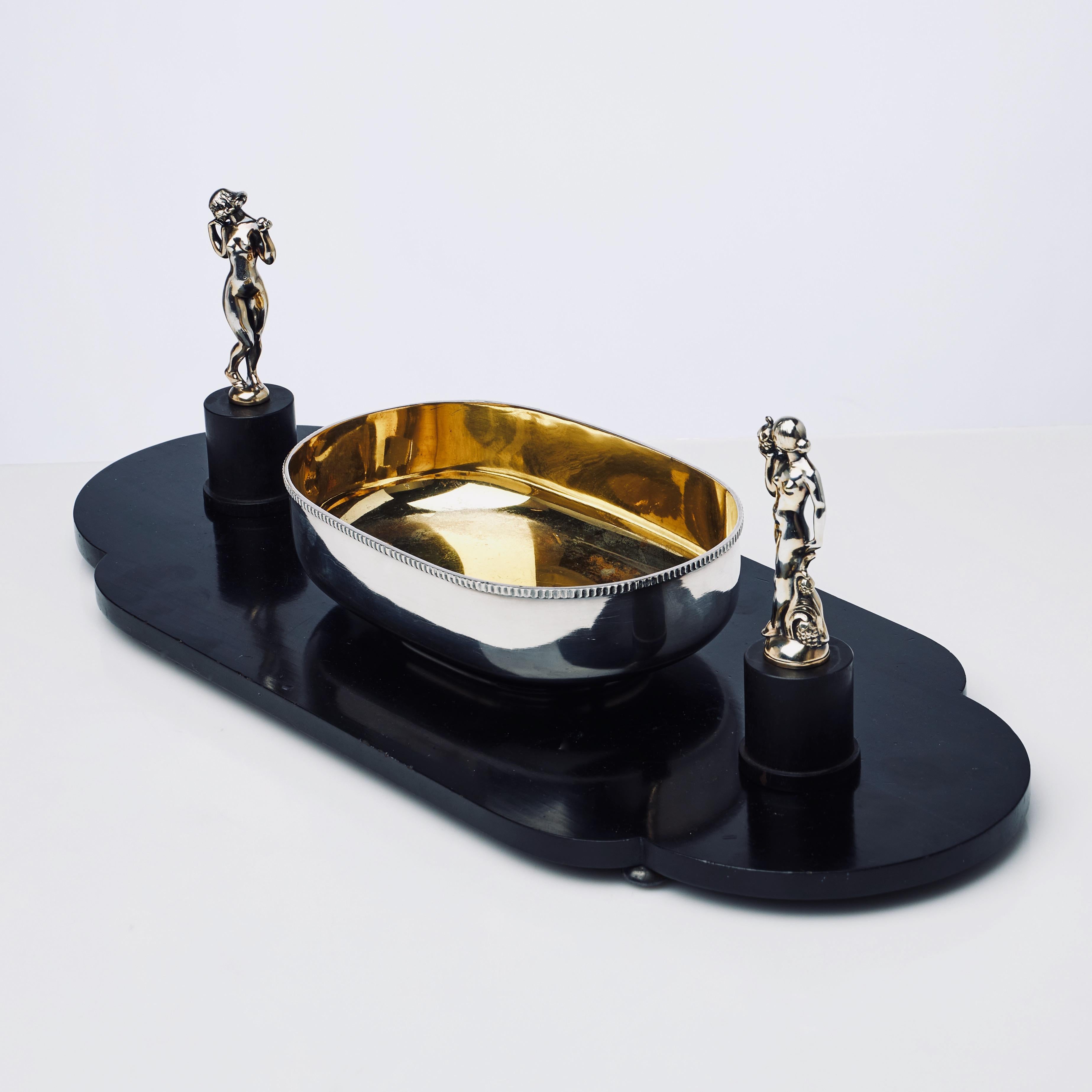 A very decorative and unique silvered bronze and ebony centerpiece made as a prototype by Gustaf Janson (1892-1979), for the Swedish court appointed, jeweler C.G Hallberg,  Made around 1925-1930, in the Swedish Grace or Art Deco style. This