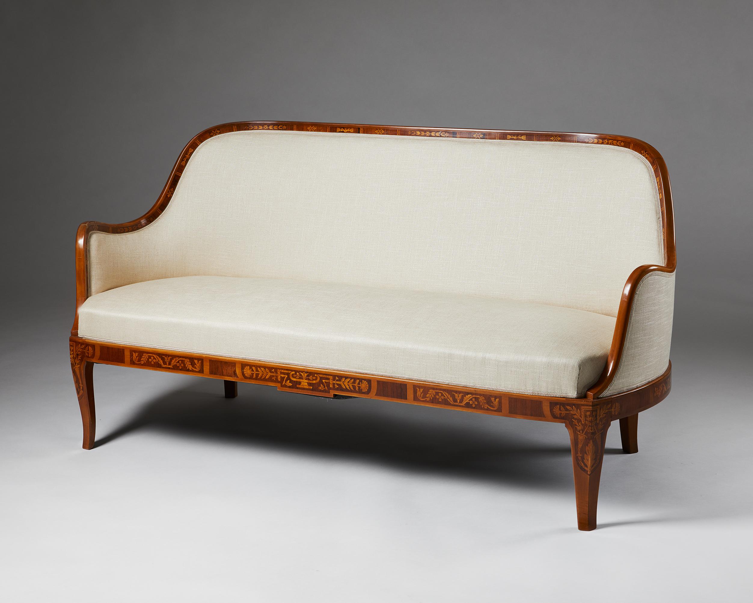 Swedish Grace sofa designed by Carl Malmsten, Sweden. 1929.

Mahogany frame with exotic wood inlay. Fabric upholstery.

Provenance: Commissioned by Erik Söderberg in 1929.

Exquisite inlays of exotic woods and a flowing shape characterise this