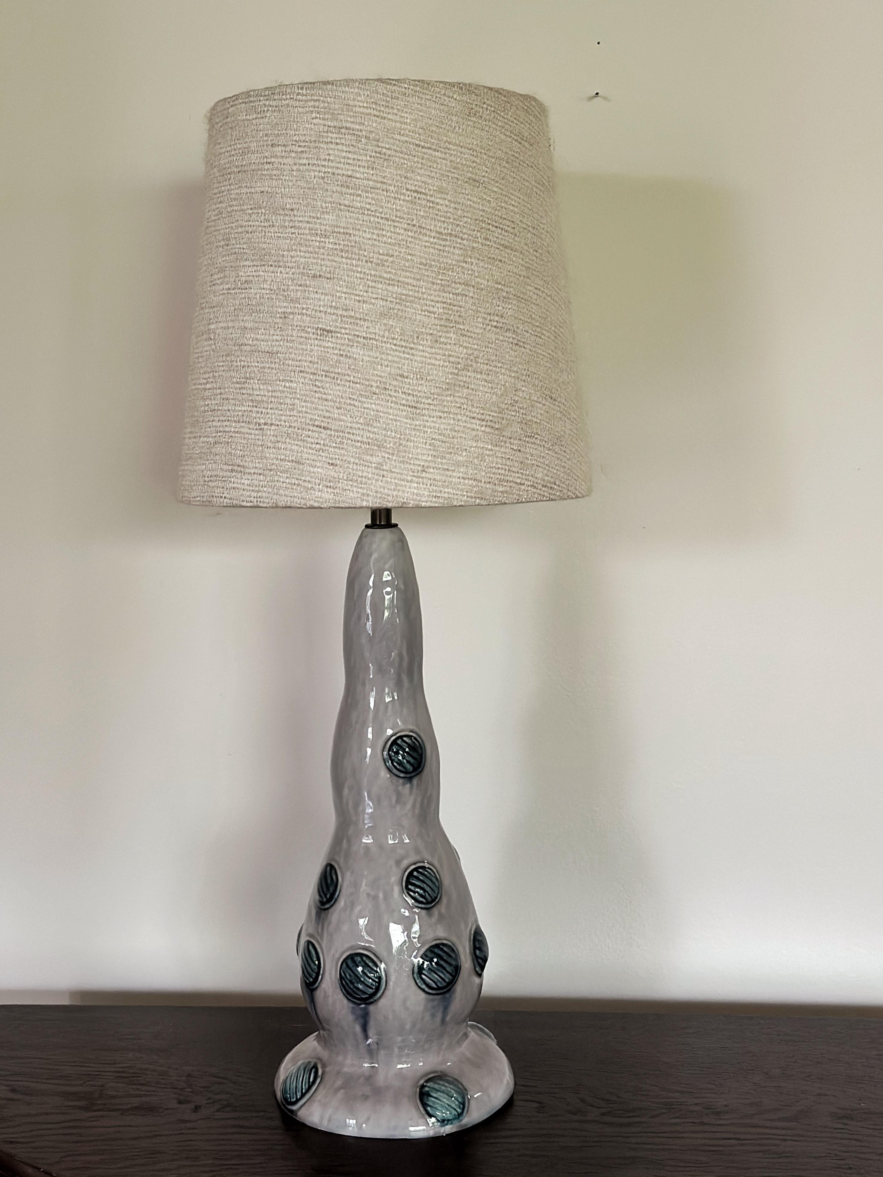 Swedish Grace Stoneware Table Lamp with Foliage Decor by Louise Adelborg for Rörstrand. 1920s.
Wonderful, Quirky and Unique table lamp made by Swedish artist Louise Adelborg in the 1920s. The lamp base is made from glazed stoneware in purple with