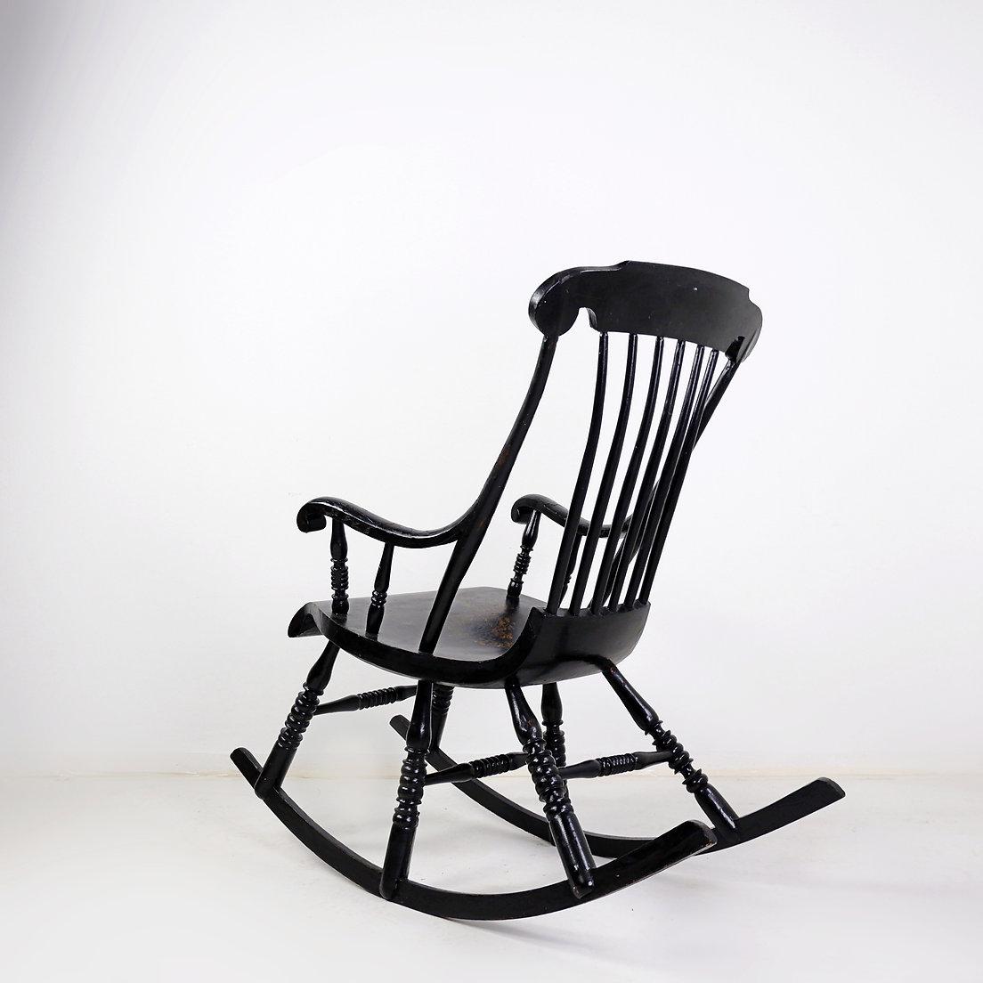 Sweden - Rocking Chair - Circa 1911
Measures : 55cmx106cm H:98cm SH:50m 
Material : Wood lacquered 
An antique spindle back rocker from Sweden dated 1911, with scrolled arms and supported by six legs and long sweeping rockers. The original painted