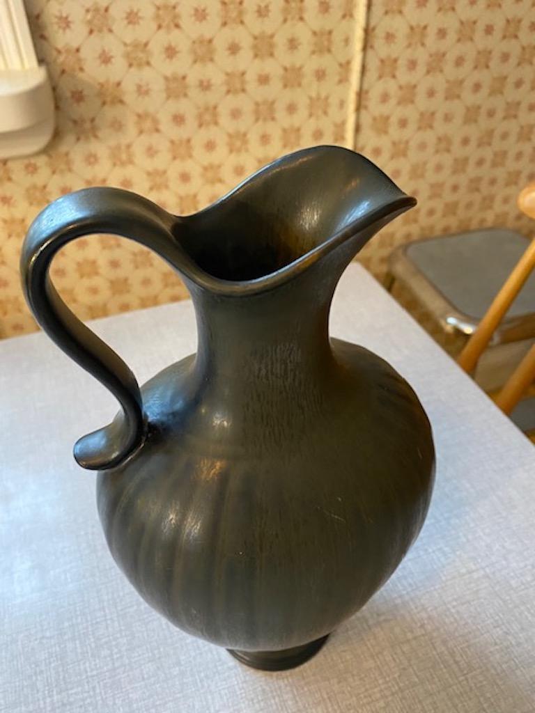 Swedish Gunnar Nylund Pitcher, Ceramic, Rörstrand, 1950's Midcentury, Signed

Gunnar Nylund, Pitcher, Rörstrand
Handmade in Ceramic
1950’s Midcentury
Color: Grey/Black
Height 11 inches / 28 cm
Made in Sweden

Perfect condition and compliment to your