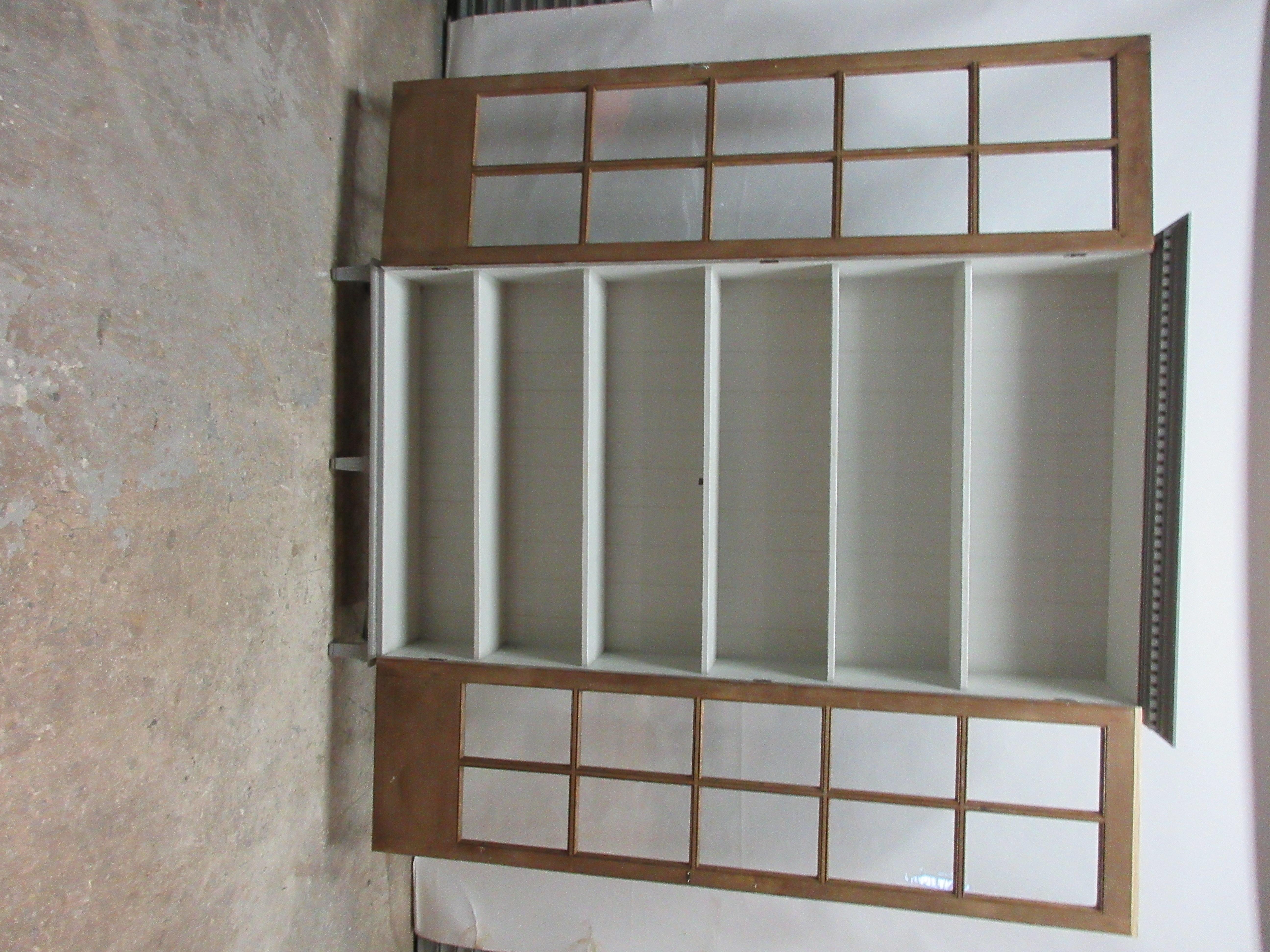 This is a Narrow cabinet and needs to be mounted to a wall so it will not fall over when the doors are open.