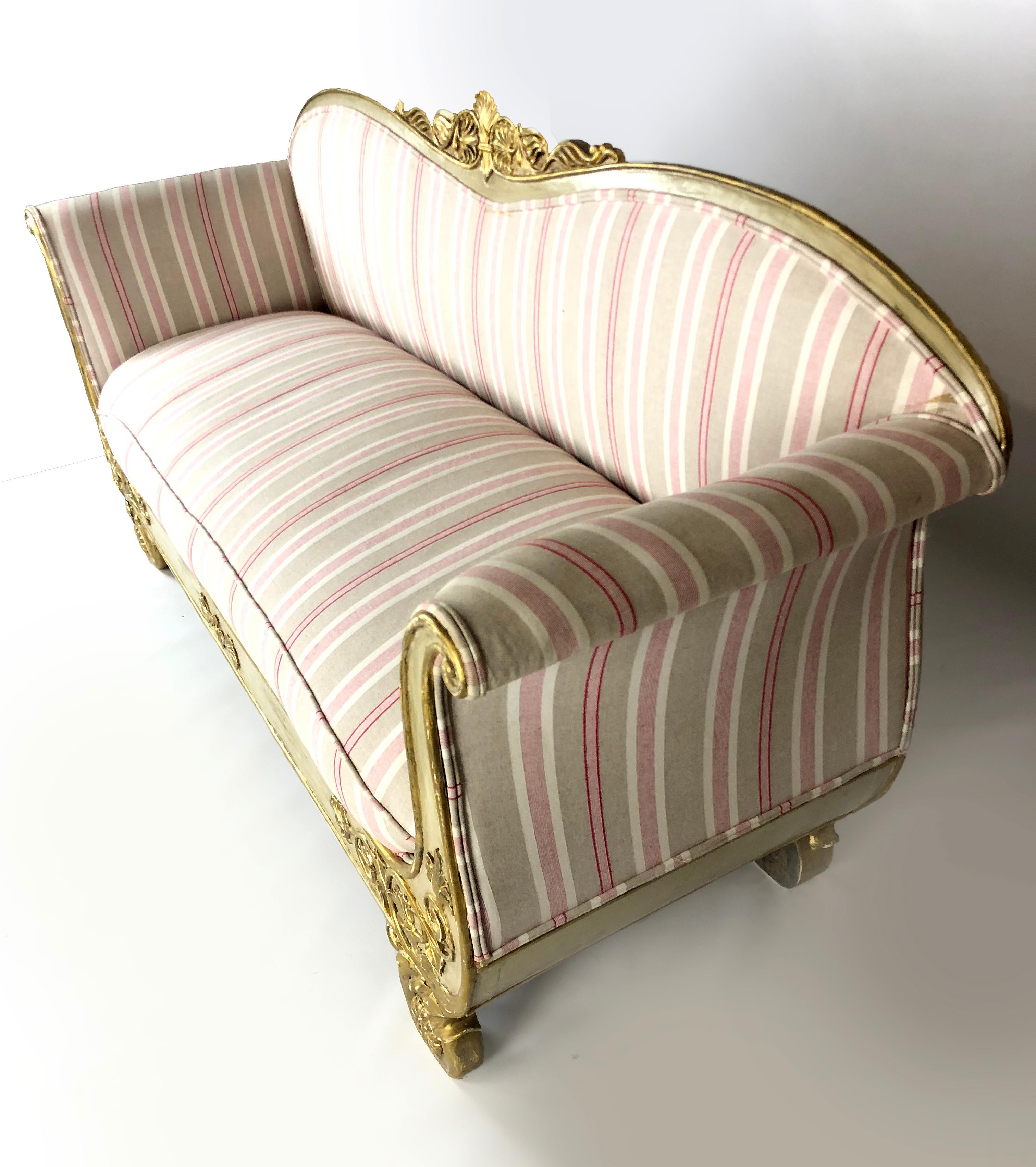 Outstanding Swedish Gustavian circa 1800 settee / sofa with graceful arches on back and sides, supported by carved medallion shaped legs. The fine frame carvings are in relief, slightly time worn and with great patina. The tiaras in the center of